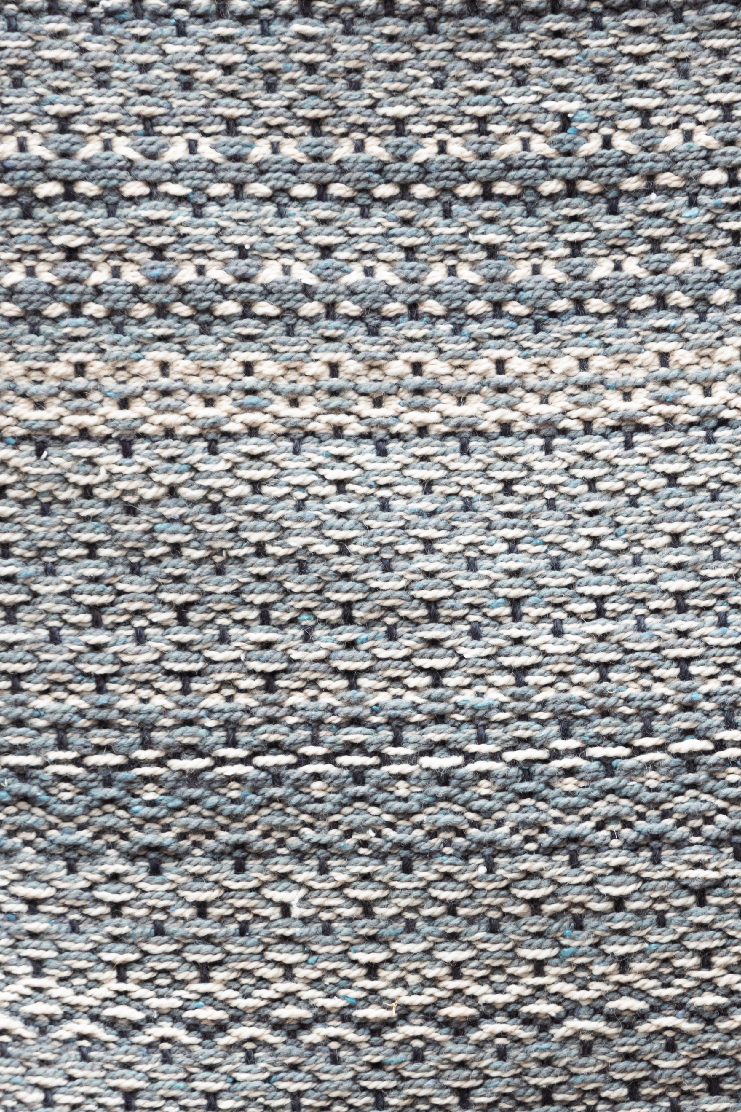 a freestyle weave creating pattern with a threeway of sumptuous merino, alpaca and silk