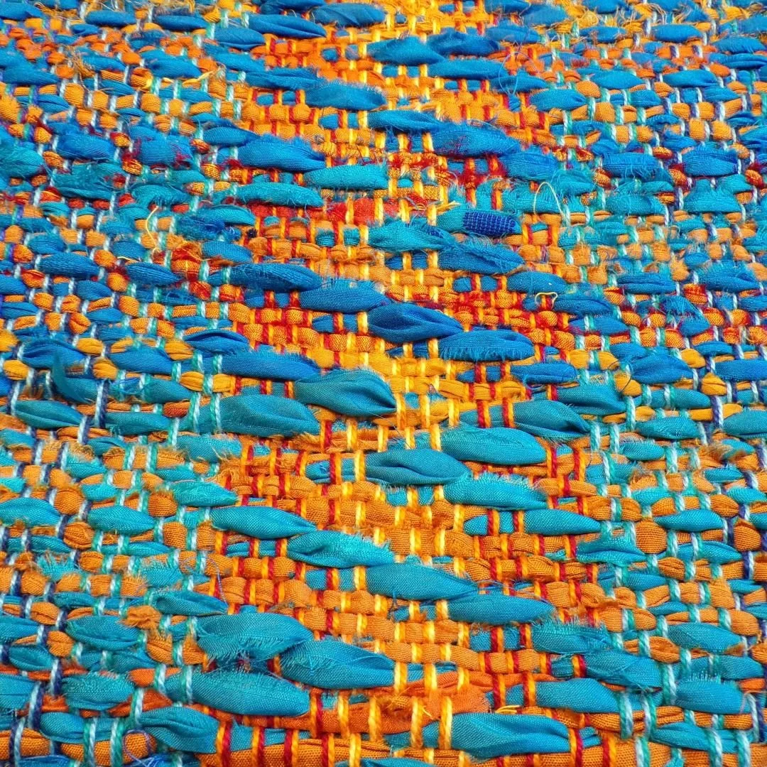 Sari silk overshot through cotton twill for a stunning 'sunset over the ocean' wall hanging