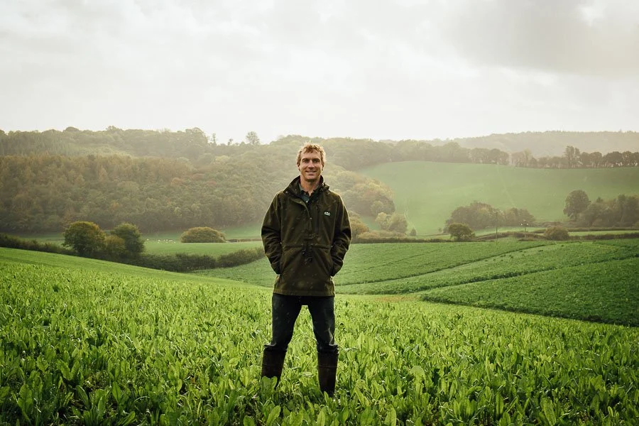 Chris stood in grass field