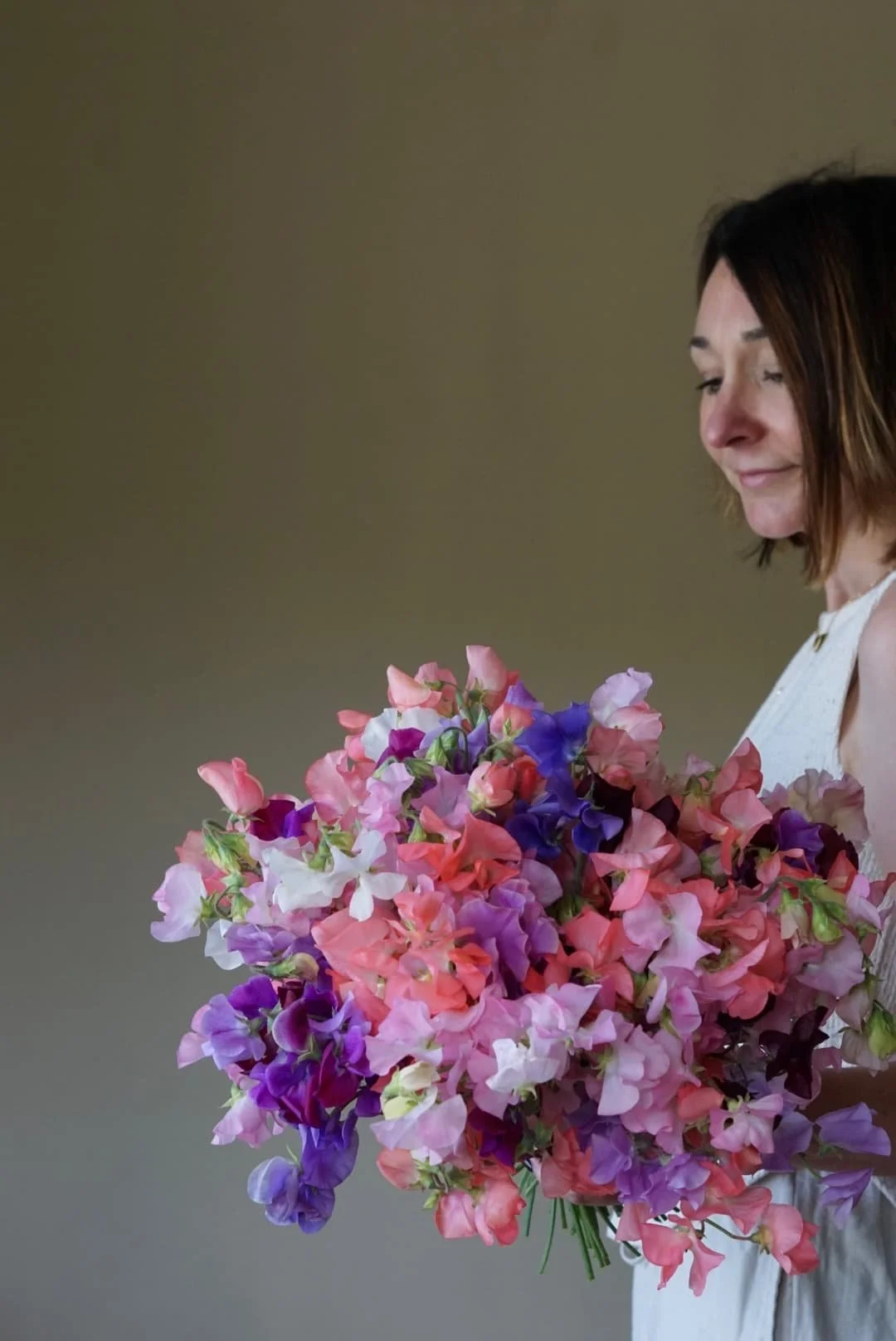 Devon florist The Rose Shed holding home grown sweet peas