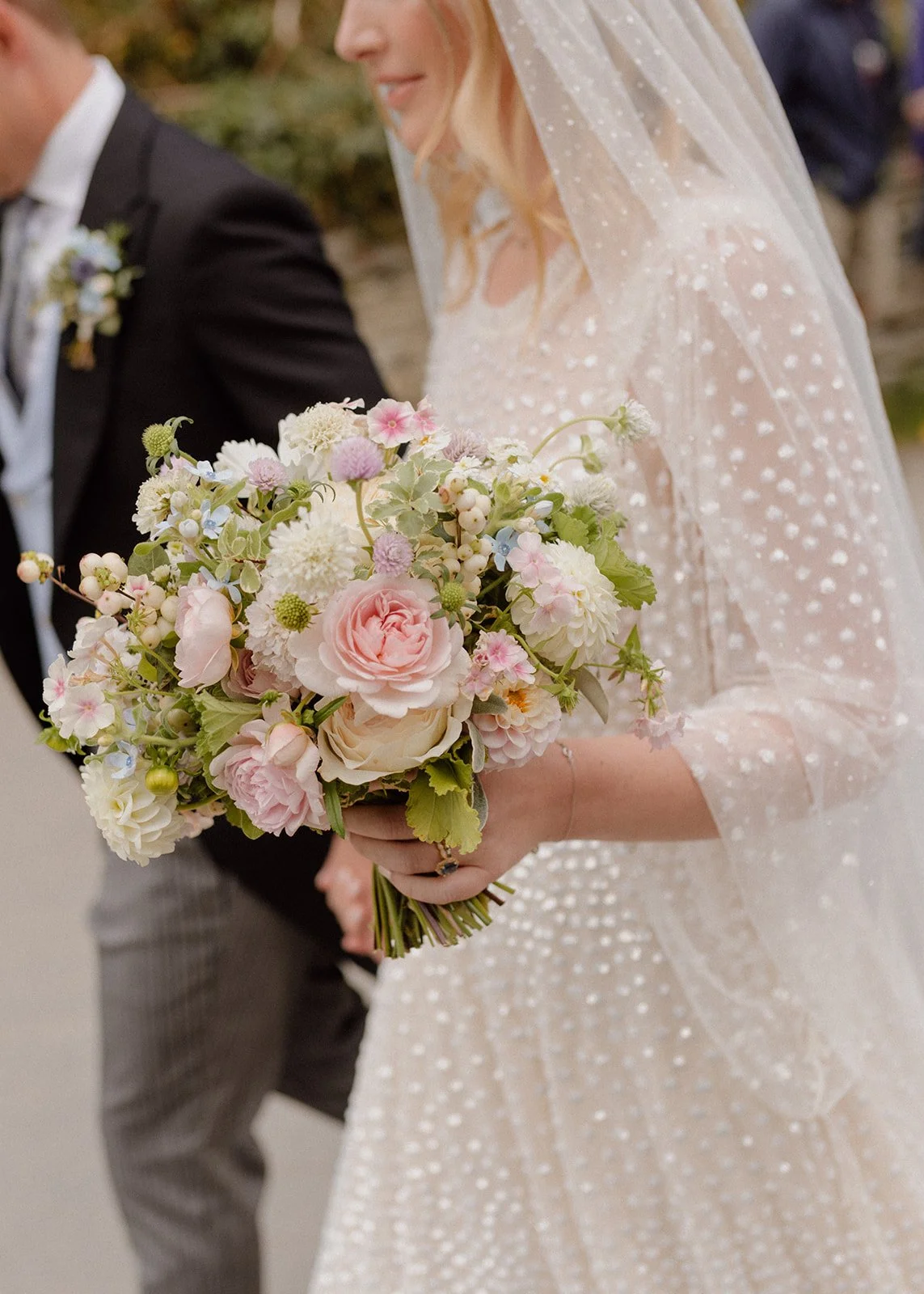bride bouquet of blush, white and pale blue roses, dahlias, scabious and locally grown British flowers