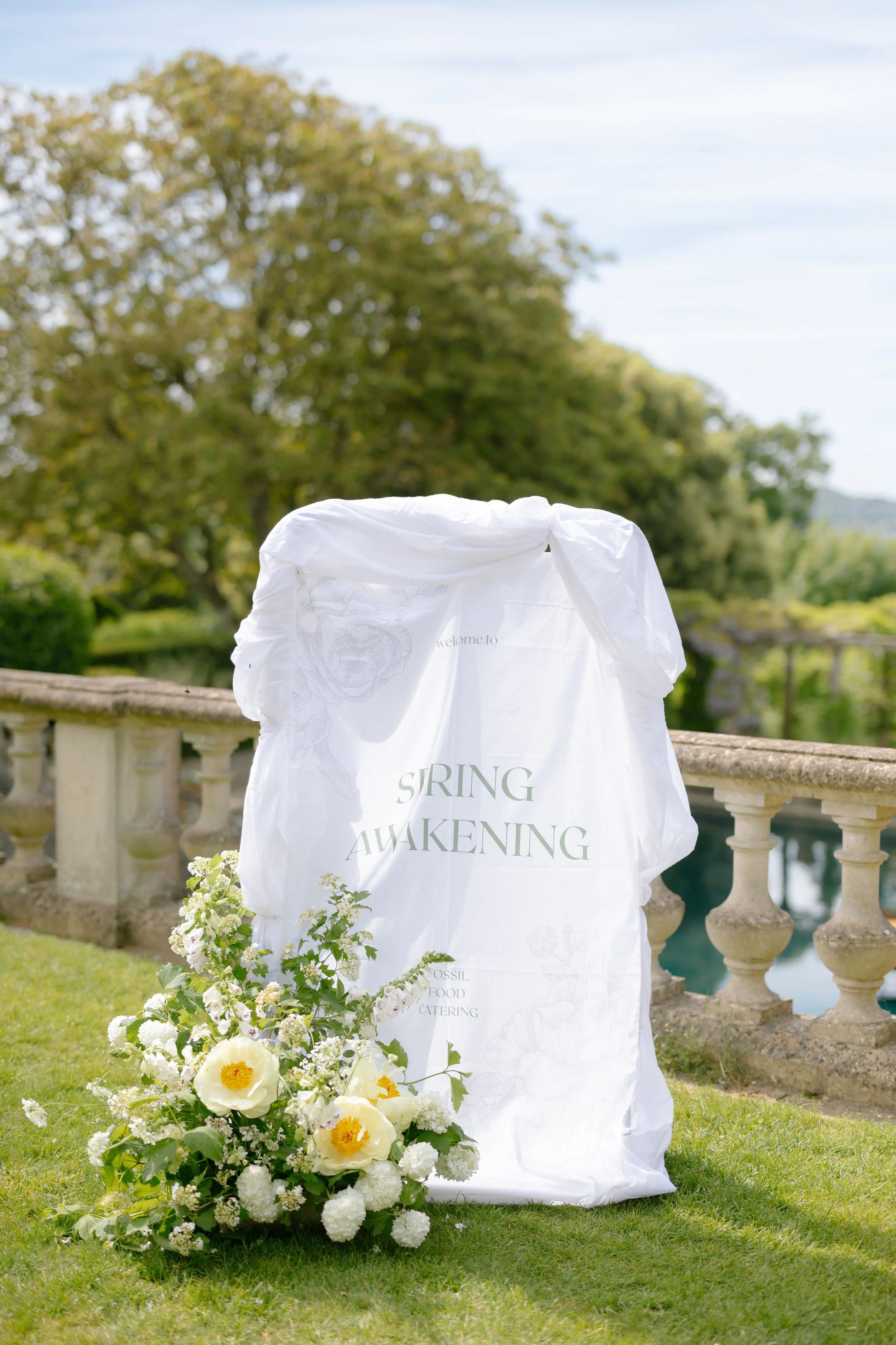butter yellow peony meadow flowers decorating outdoor welcome sign at Euridge