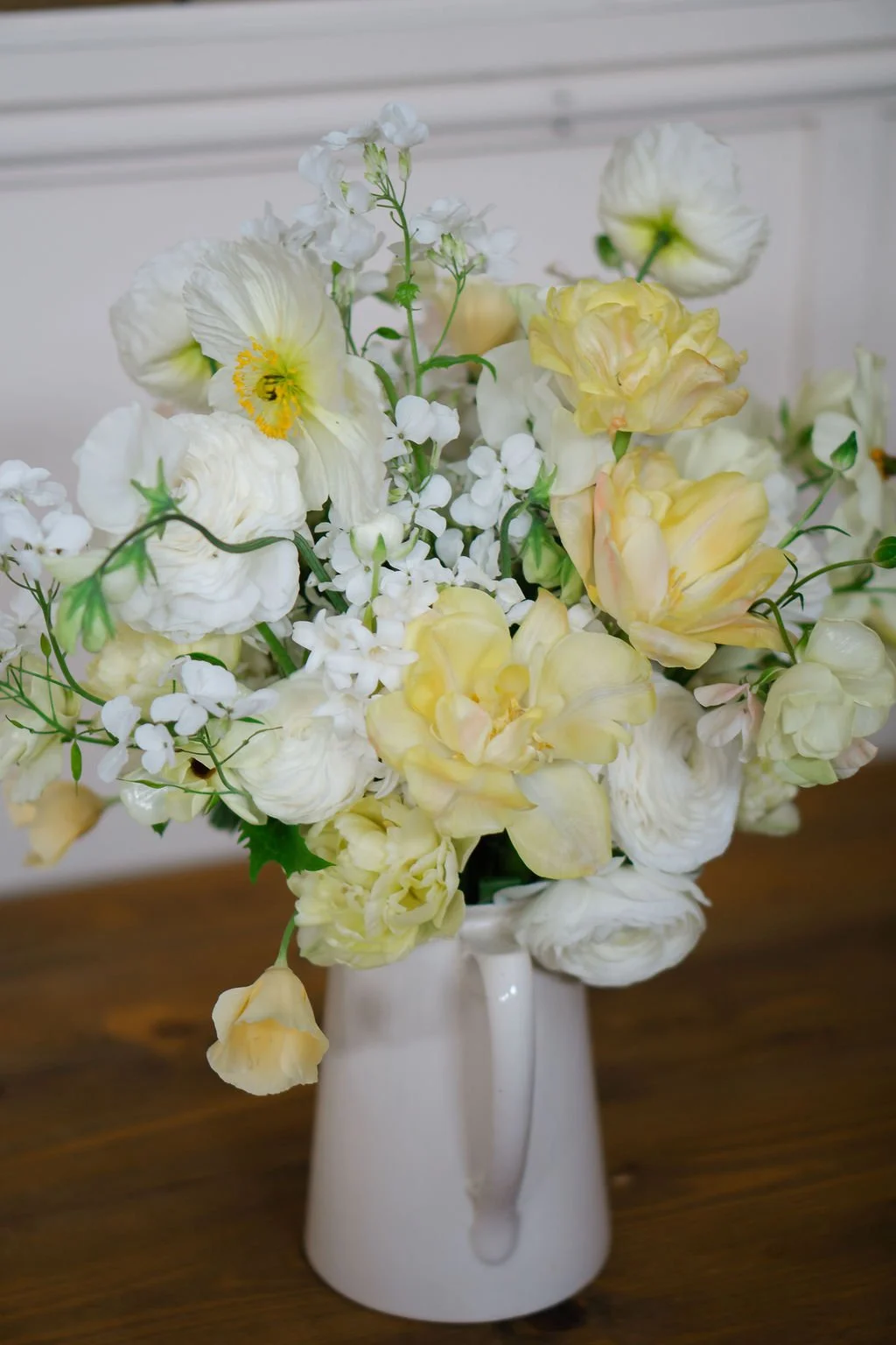 butter yellow bridal bouquet full of poppies, tulips, ranunculus and sweeties
