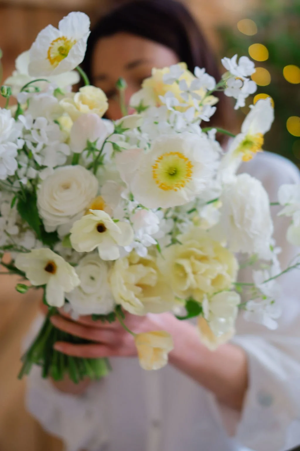poppy, ranunculus, tulip, sweet pea and butterfly ranunculus butter yellow and white bride bouquet