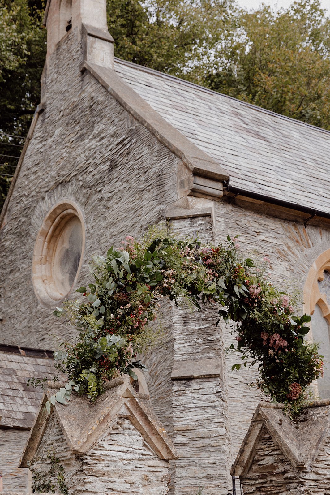lych gate flower arch outside north Devon Lee Bay church