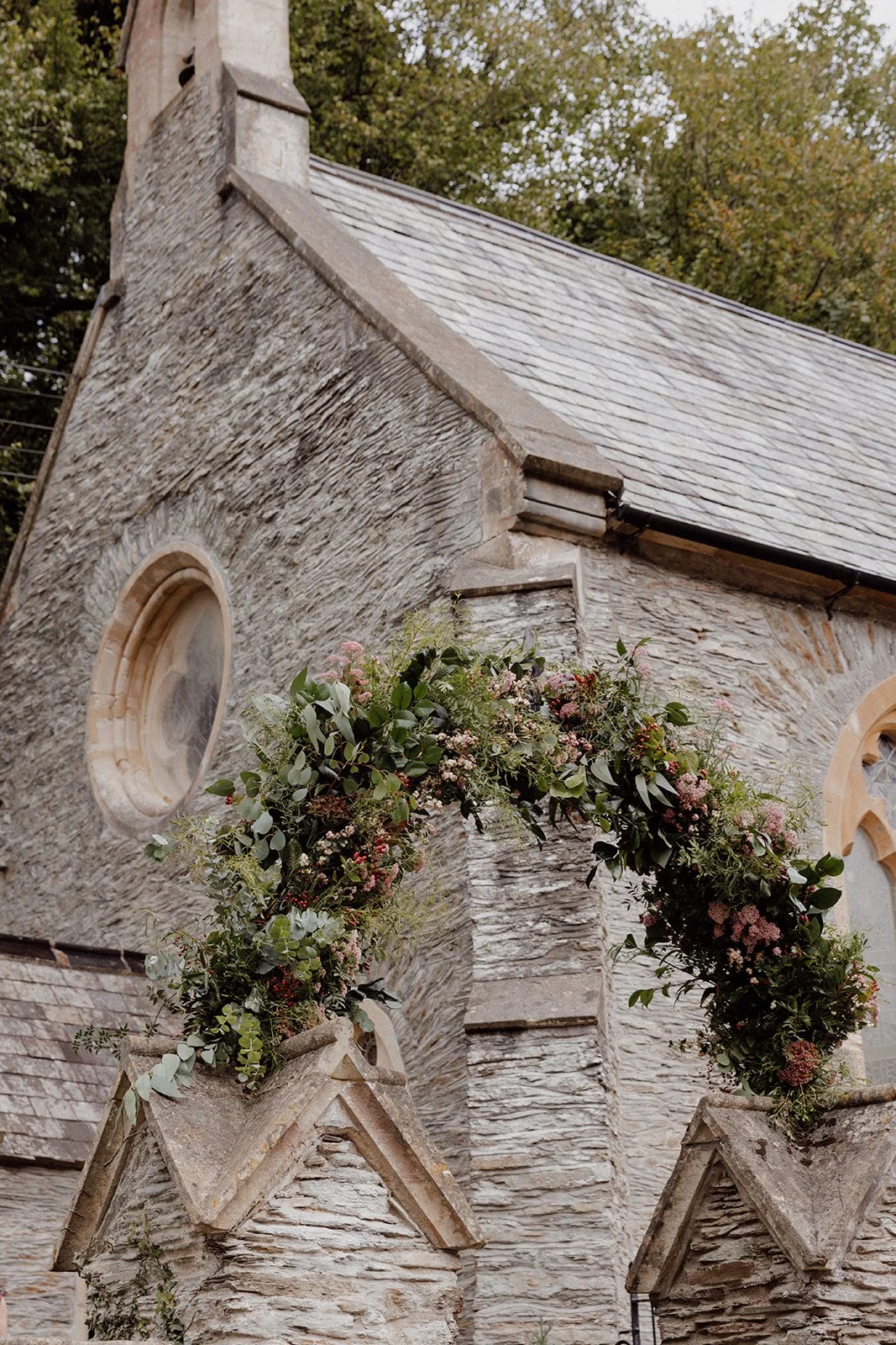 Sumer flower archway on Lee Bay church iron entrance lychgate