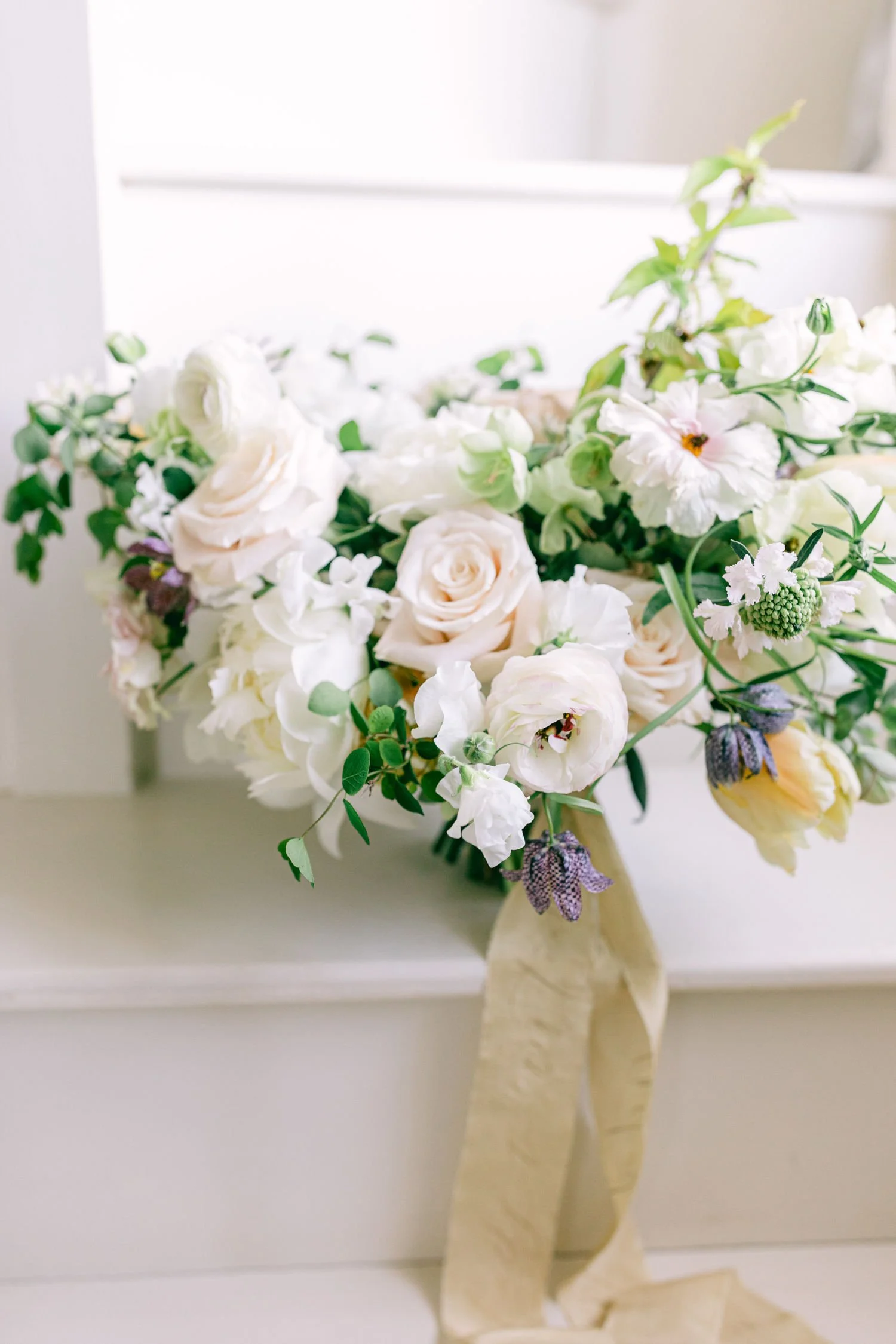 blush, ivory and pale peach spring wedding bouquet with trailing silk ribbon