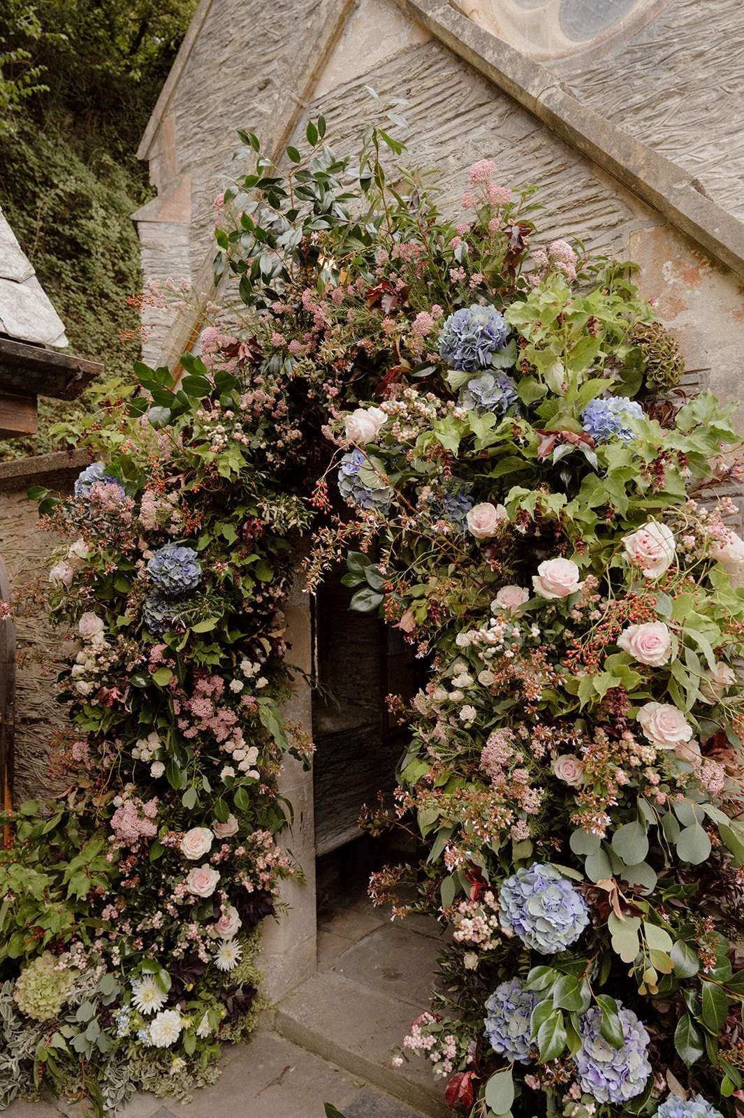 seasonal summer statement church flower archway at Lee Bay church