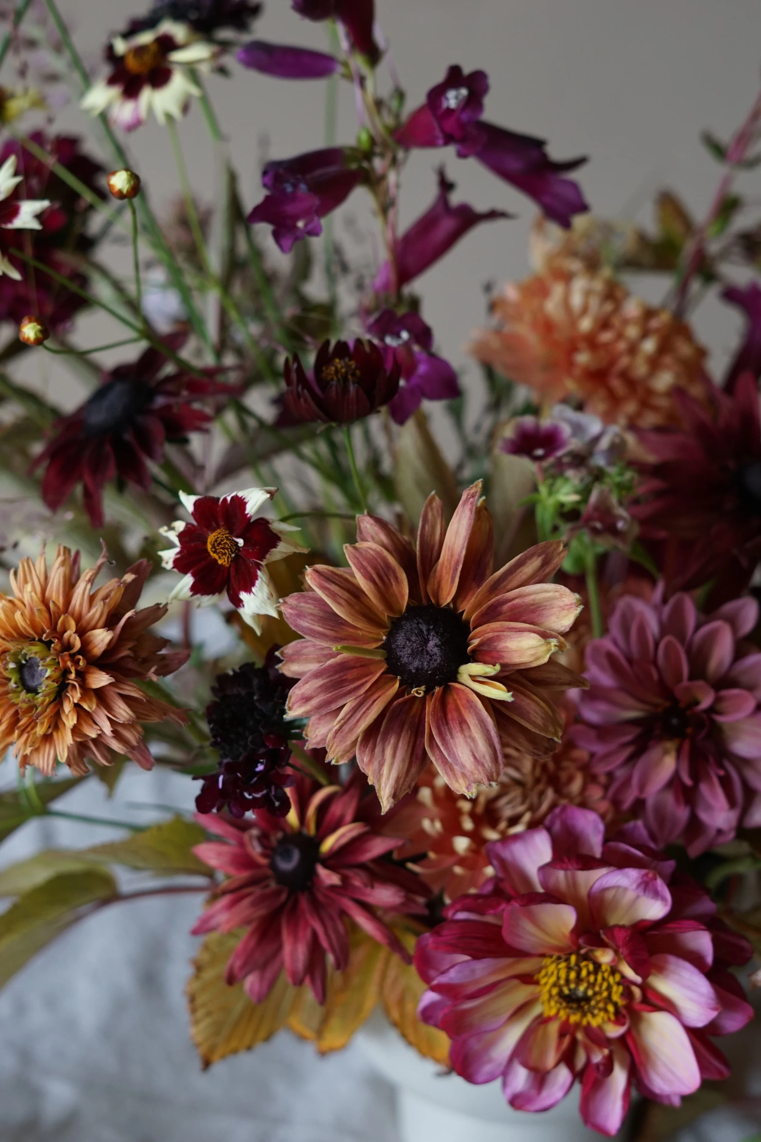 low bowl arrangement of rudbekia and dahlia for wedding tables