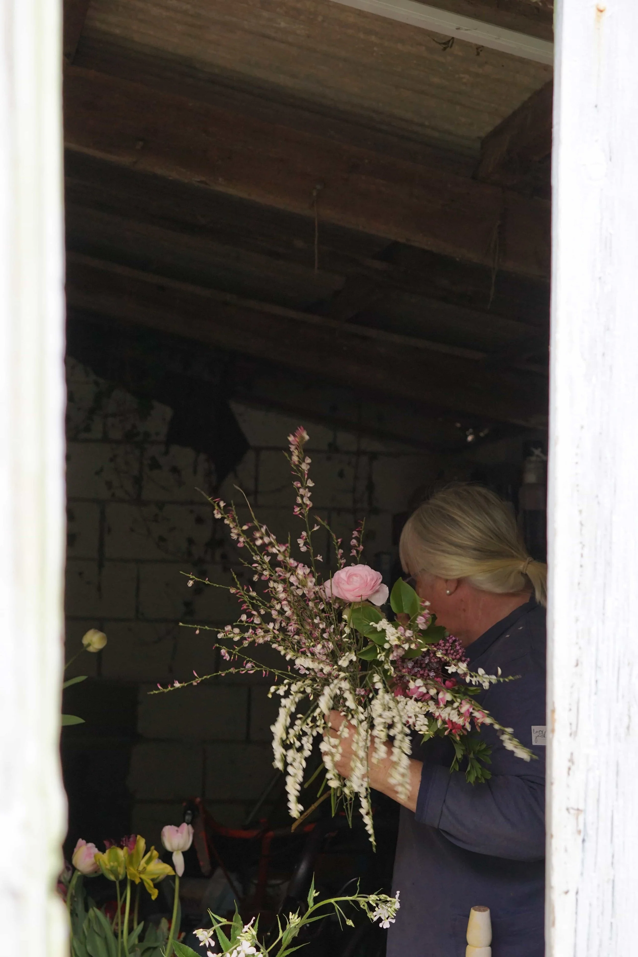 The Forgotten Garden Pat in her workshop making a beautiful locally grown bouquet