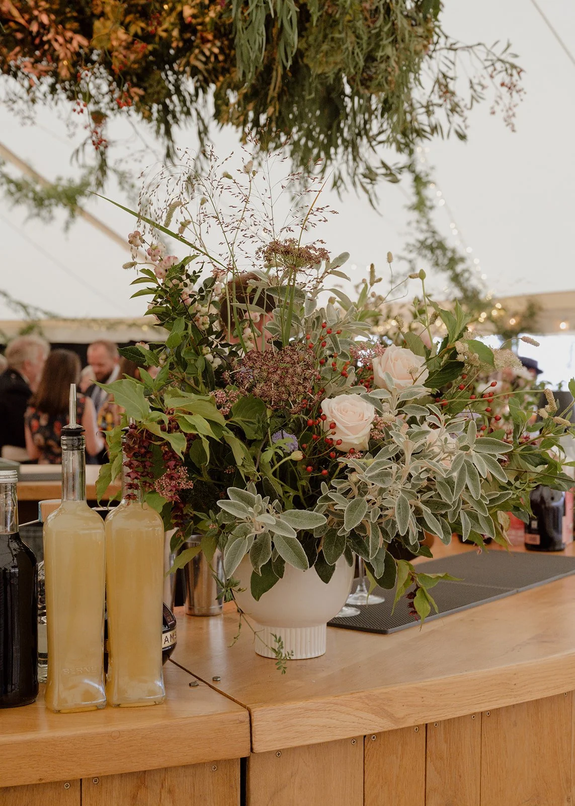 large statement natural seasonal flower vase on marquee bar in Croyde