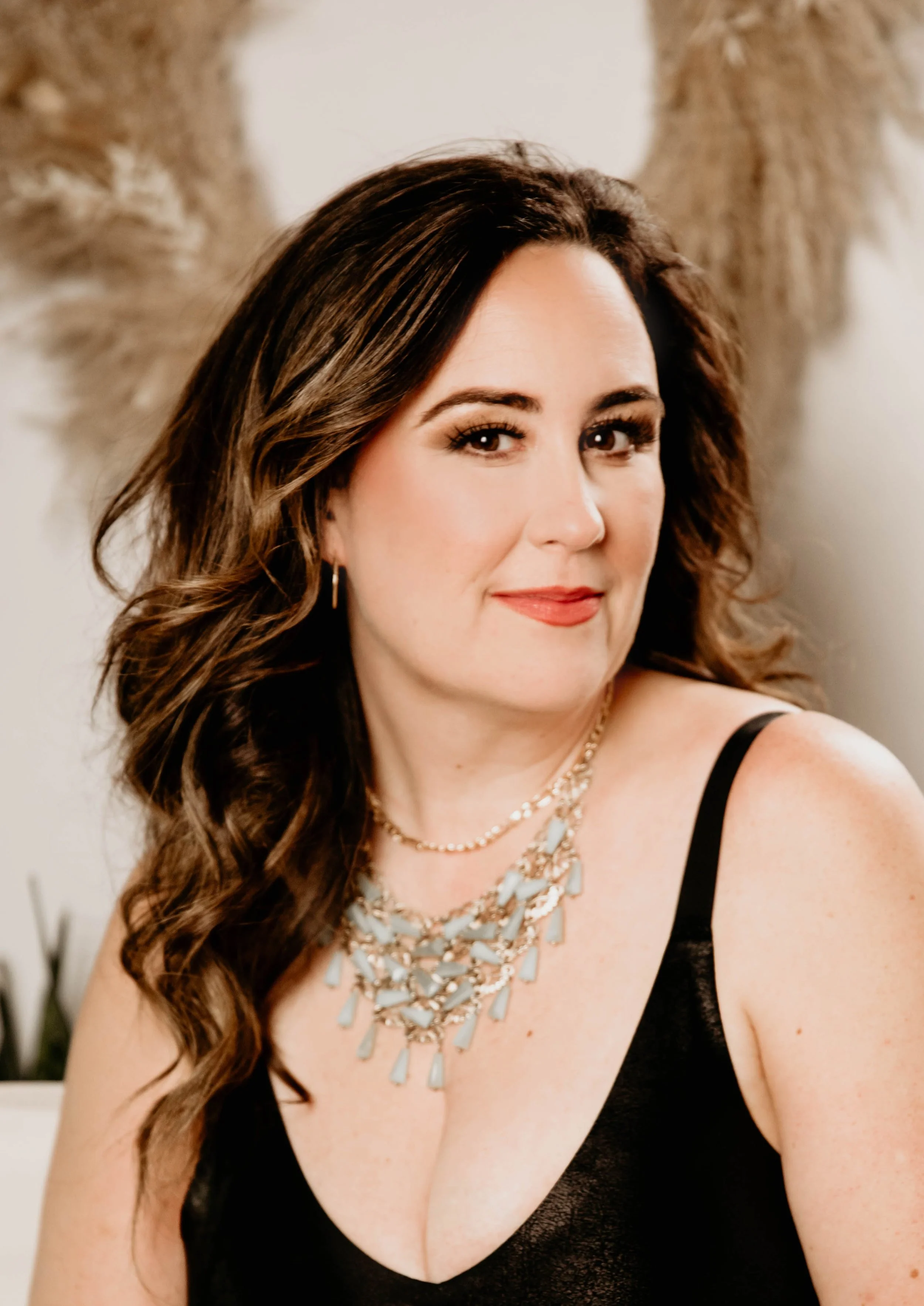 Lou Clarke in a black tank top, your money coach