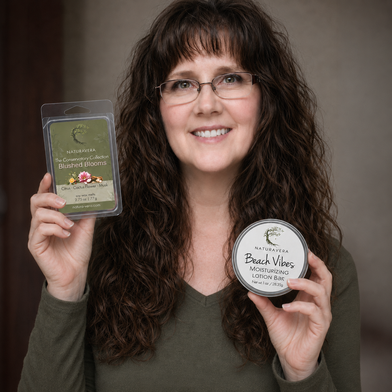 Naturavera founder Jennifer Gunderson smiling while holding a soy wax melt and moisturizing lotion bar.