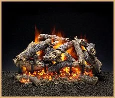 Burning charcoal and small flames rising from it.