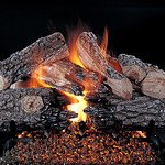 Rasmussen Evening Prestige Log set Glowing hot coals and burning wood in a fireplace.