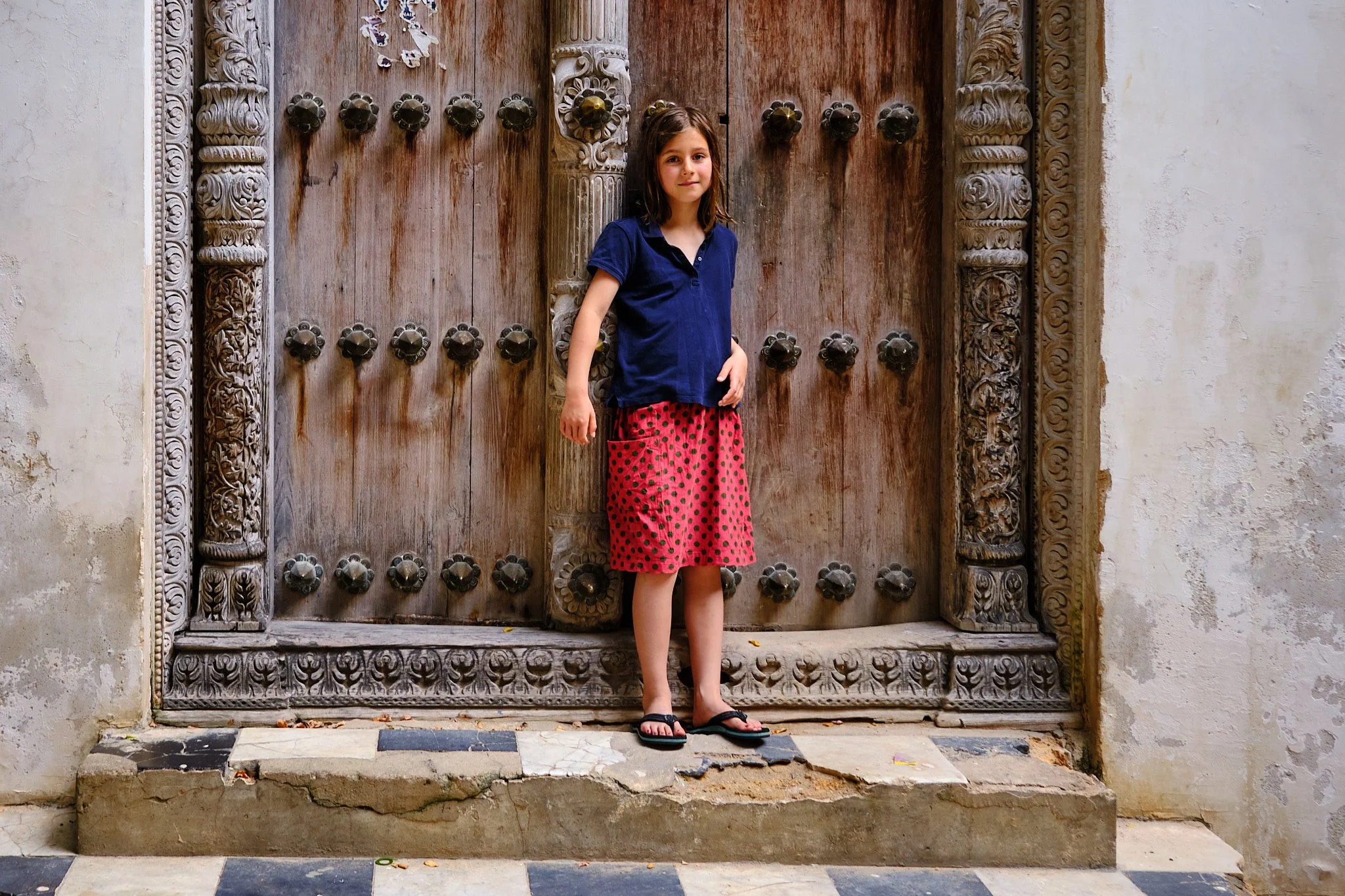 Anna infront of a Swahili Door in Stone Town, Zanznibar