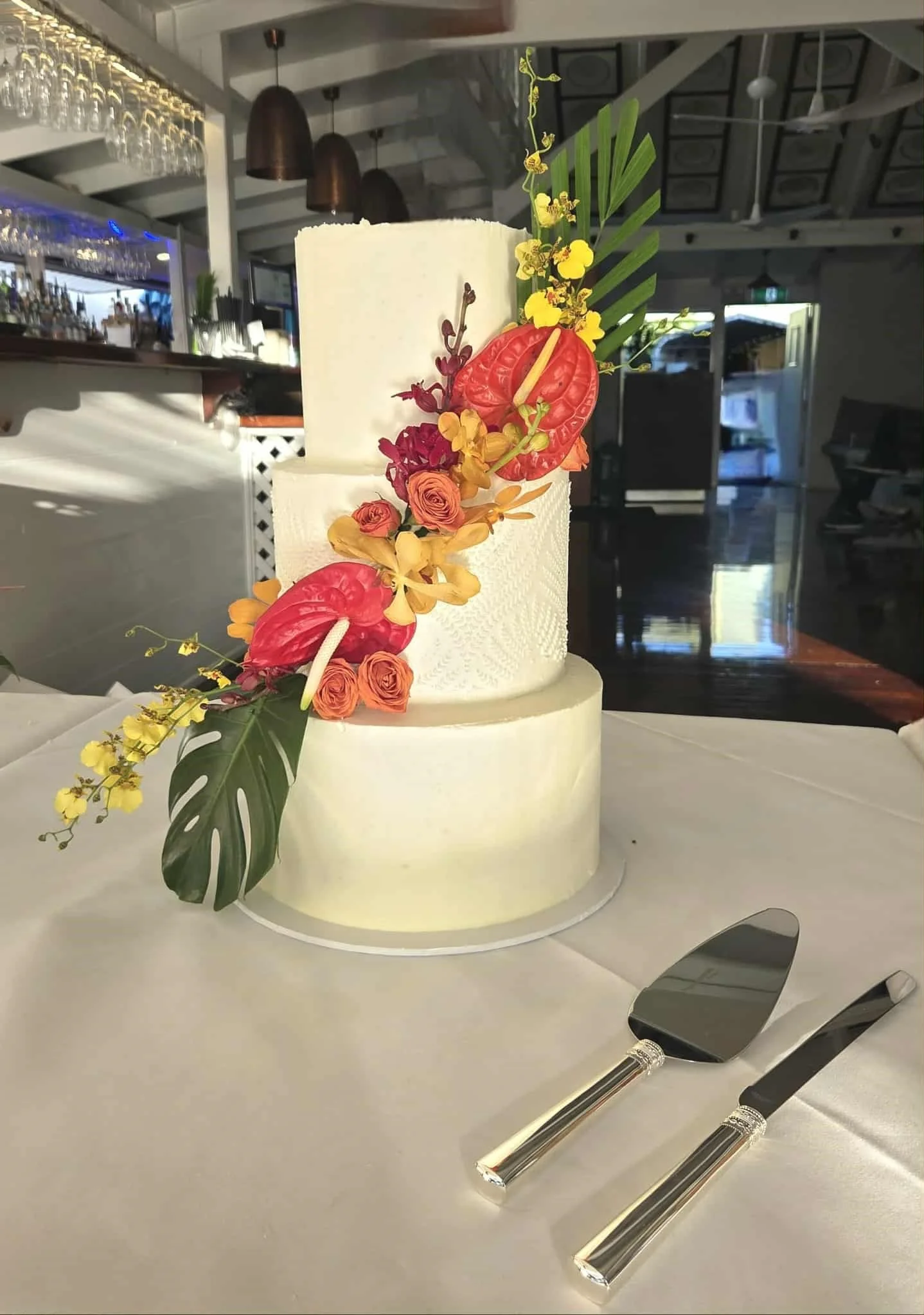 Neutral cake with tropical flowers.jpg