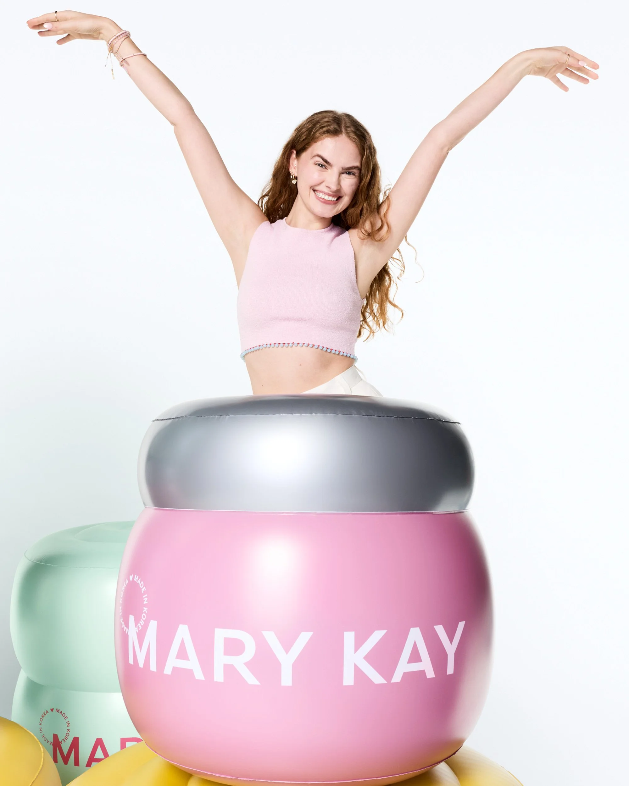 joshua-pestka-mary-kay-k-beauty-arms-raised-model-giant-pink-jar.jpg