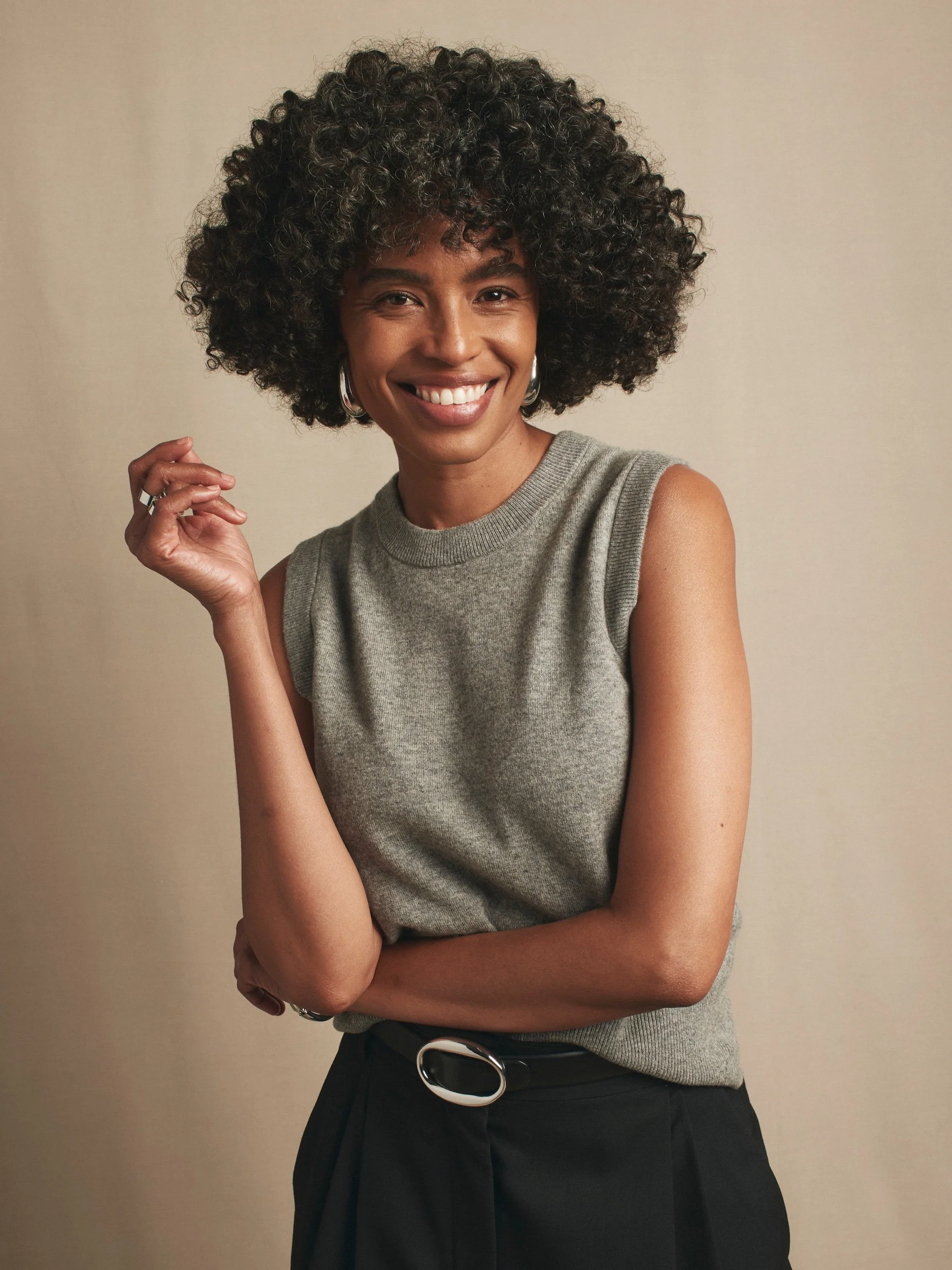 Joshua Pestka commercial beauty photography — Mary Kay TimeWise Repair campaign, model with natural curly hair laughing, confident pose
