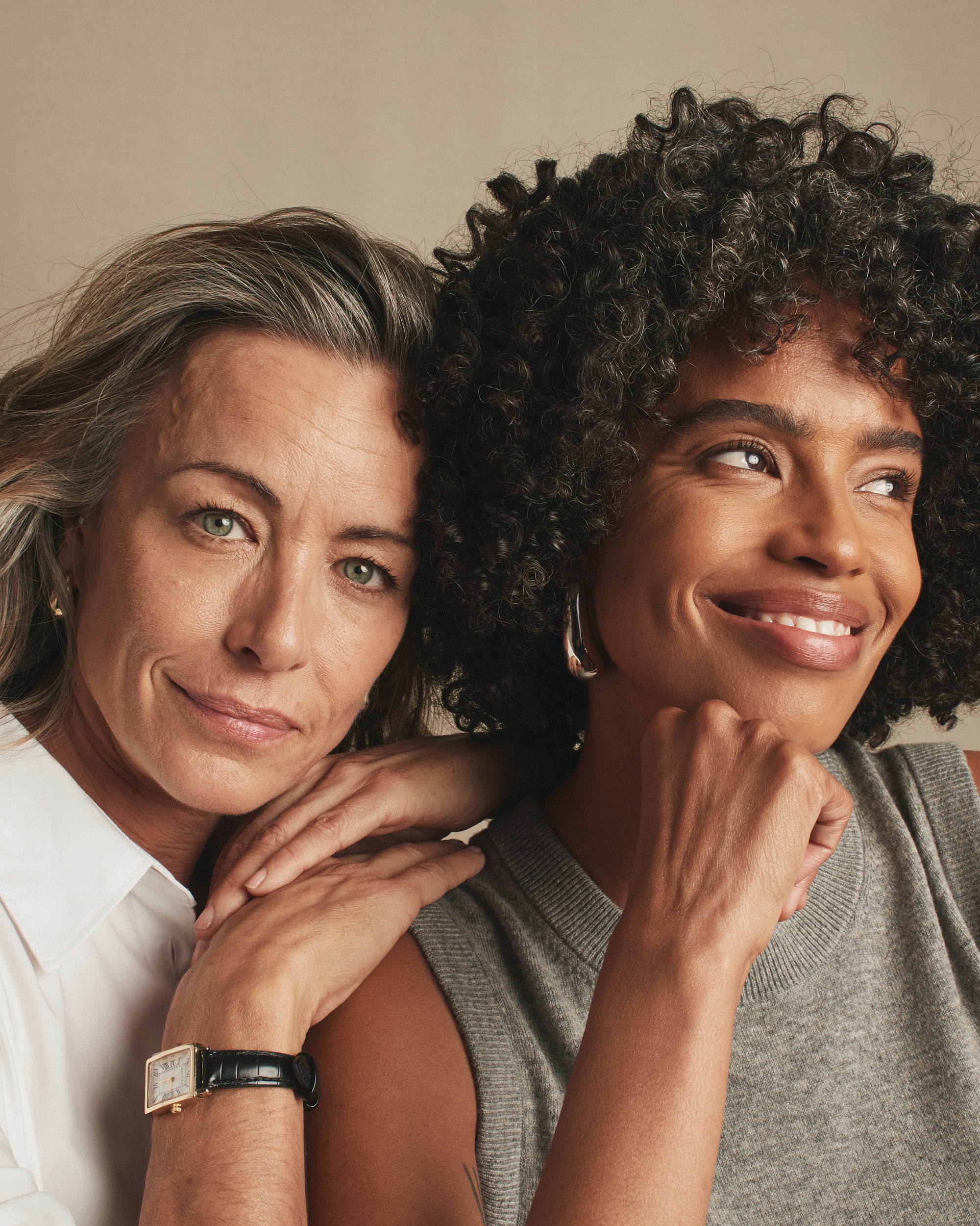 Joshua Pestka commercial beauty photography — Mary Kay TimeWise Repair campaign, two models together, warm embrace, studio portrait