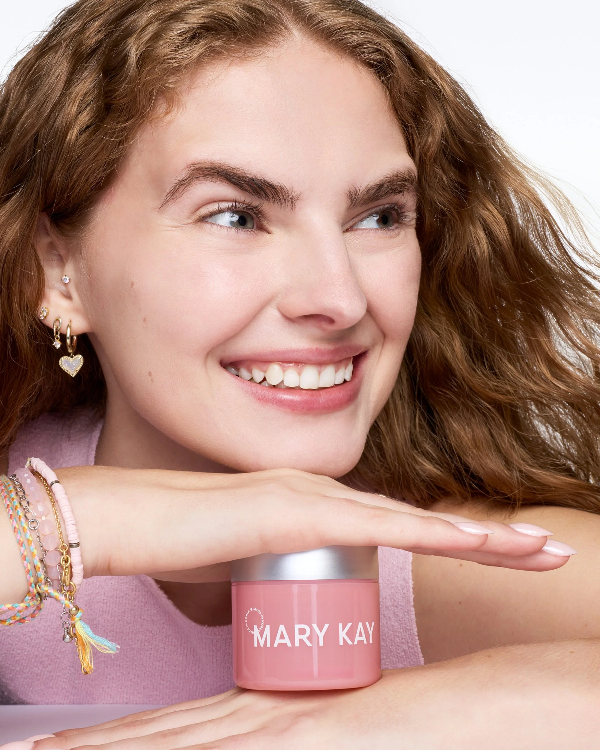 joshua-pestka-mary-kay-k-beauty-collagen-gel-pink-jar-smiling-model-bracelets.jpg