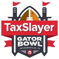 Logo for TaxSlayer Gator Bowl featuring a football, two towers with flags, and the text 'TaxSlayer Gator Bowl Jacksonville, FL'.
