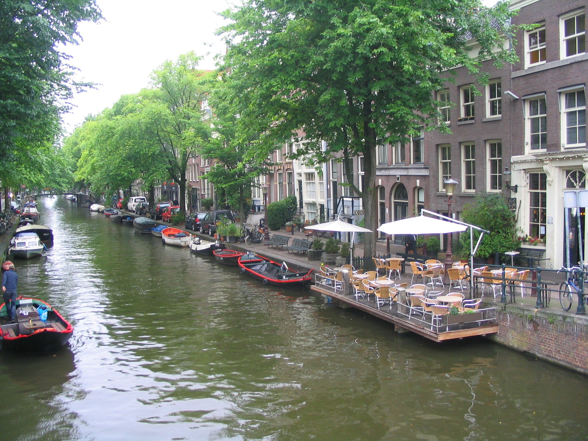 Amsterdam canal with historic gabled buildings and canal boats.JPG