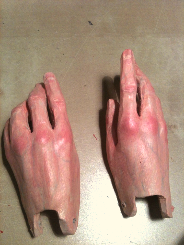 Puppet hands, made out of foamex and milliput, painted with acrylic paint.