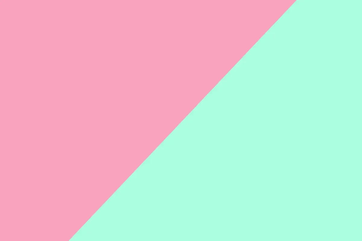 A diagonal split pink and mint green background