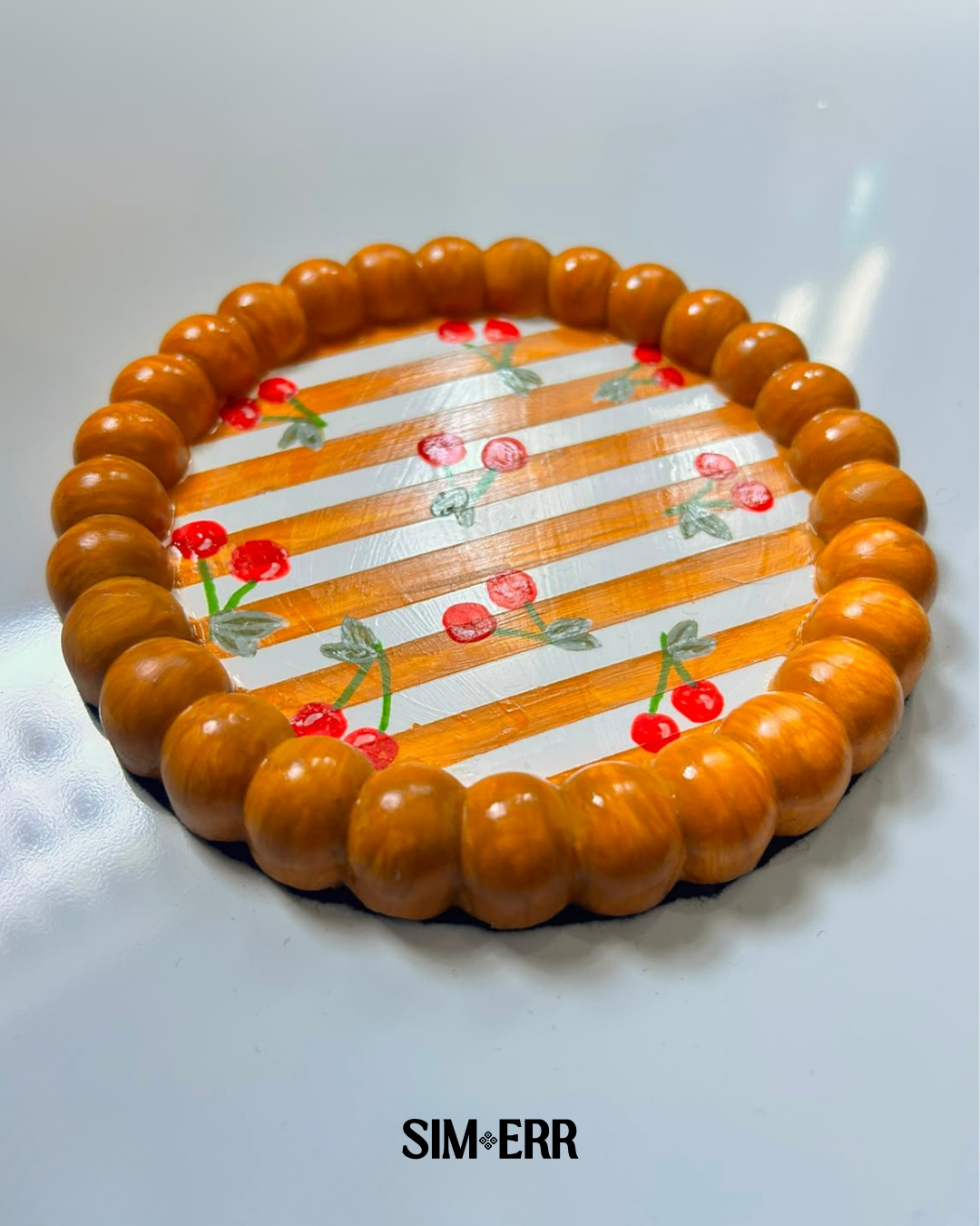 Handmade orange and white striped bubble tray with hand-painted cherries by Sim.err side view