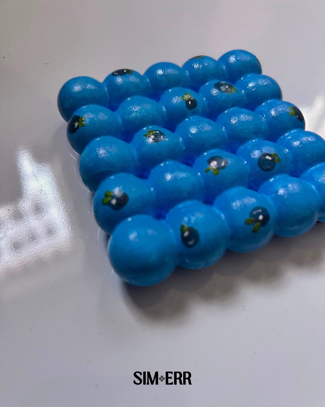 Bright blue handmade bubble coaster with miniature painted blueberries by Sim.err