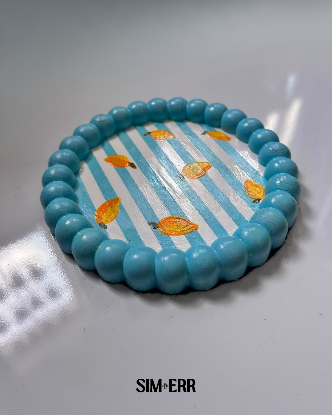 Handmade blue and white striped 6-inch bubble tray with hand-painted mangoes by Sim.err side view