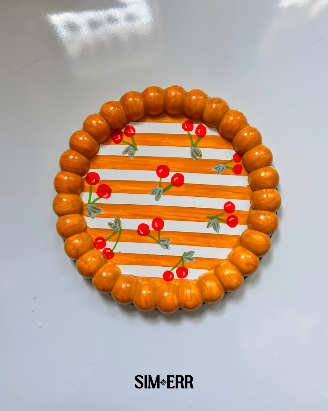Handmade orange and white striped bubble tray with hand-painted cherries by Sim.err top view