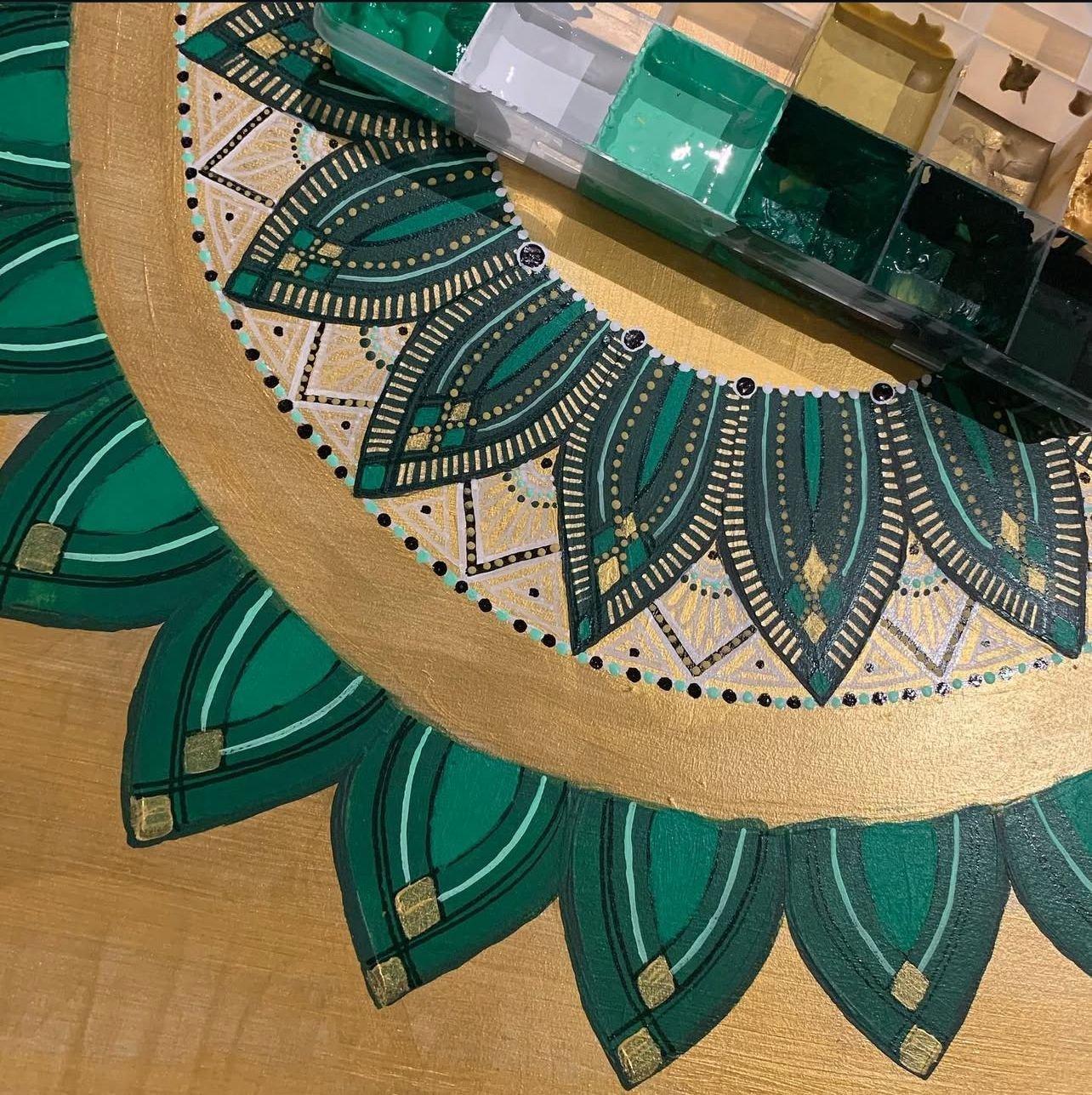 This is a hand painted mandala on MDF using acrylic paint