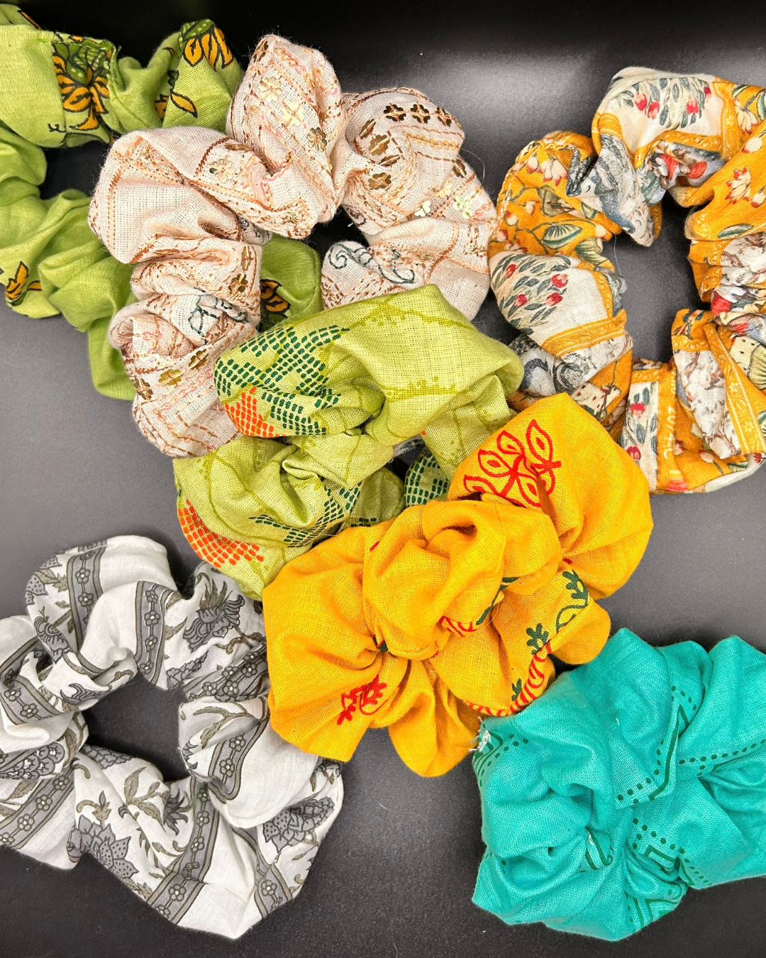 Collection of colourful printed cotton and linen scrunchies by Sim.err