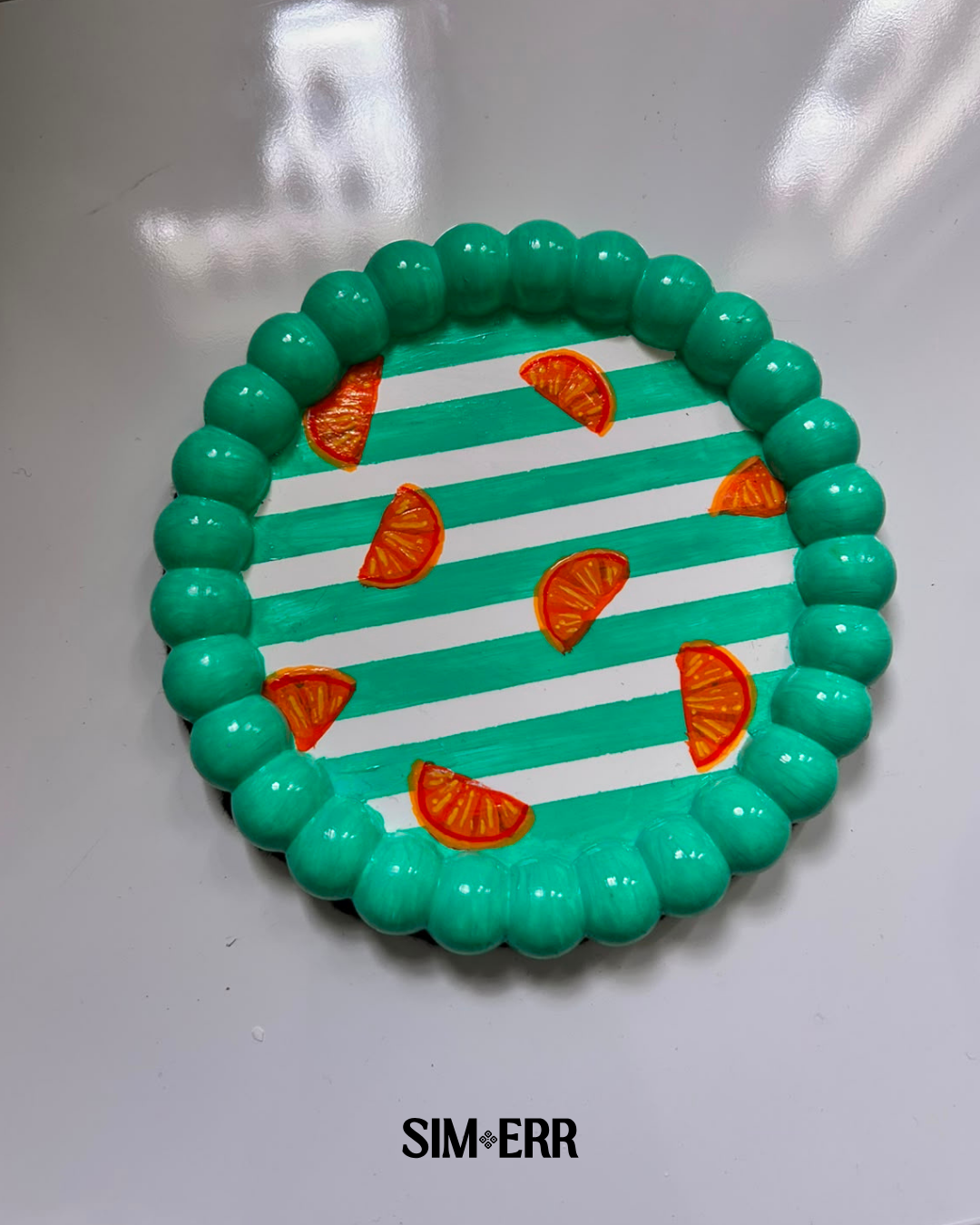 Handmade teal striped bubble tray with hand-painted orange slices by Sim.err top view