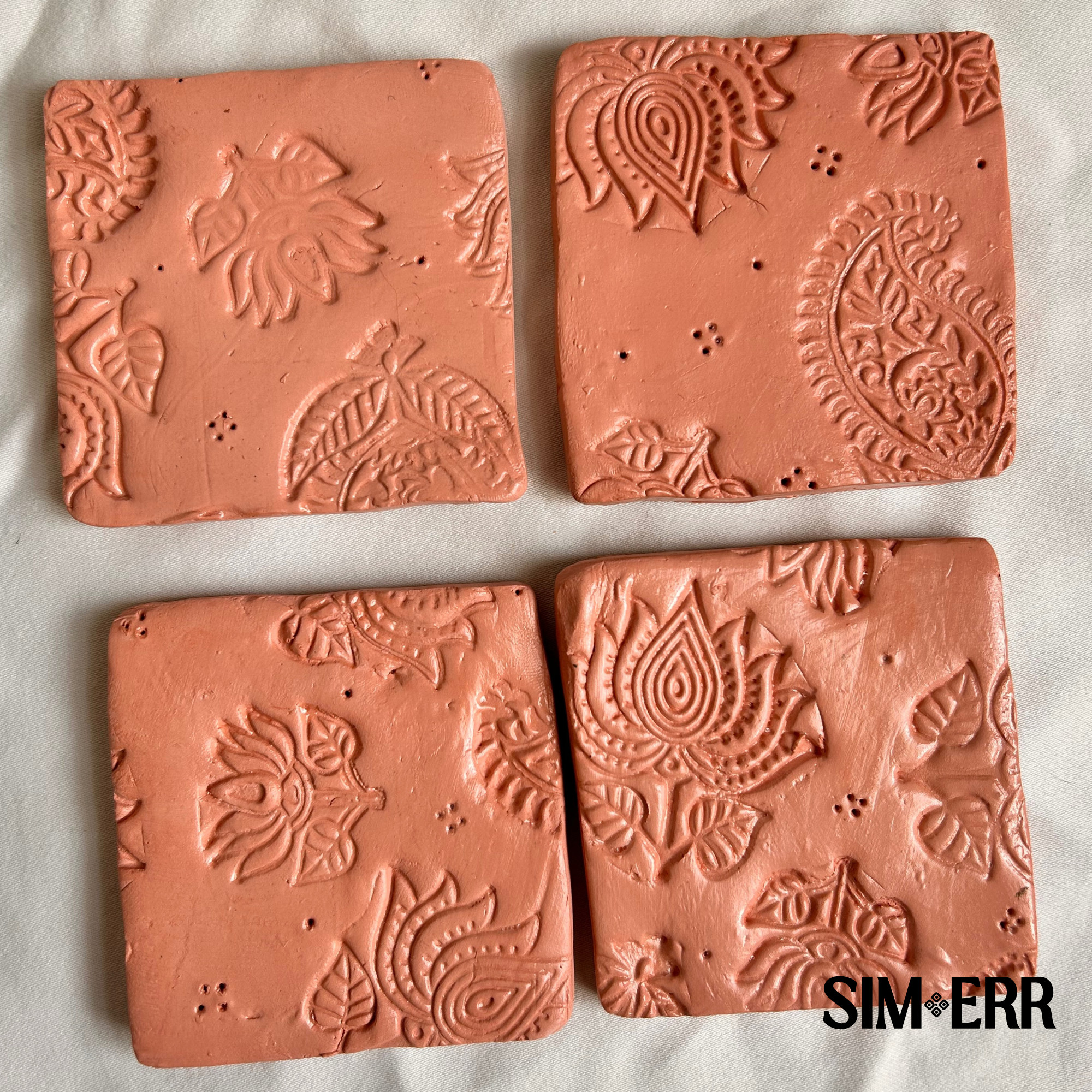 These are printed patterns on air dry clay finished with a gloss