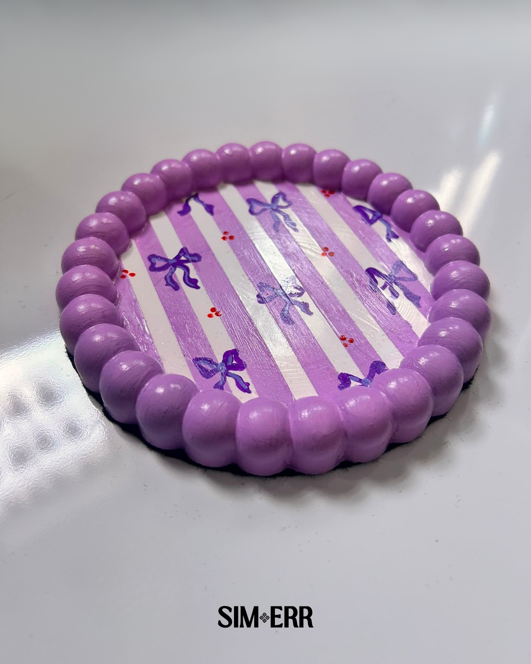 Handmade lavender and white striped bubble tray with hand-painted purple bows by Sim.err side view