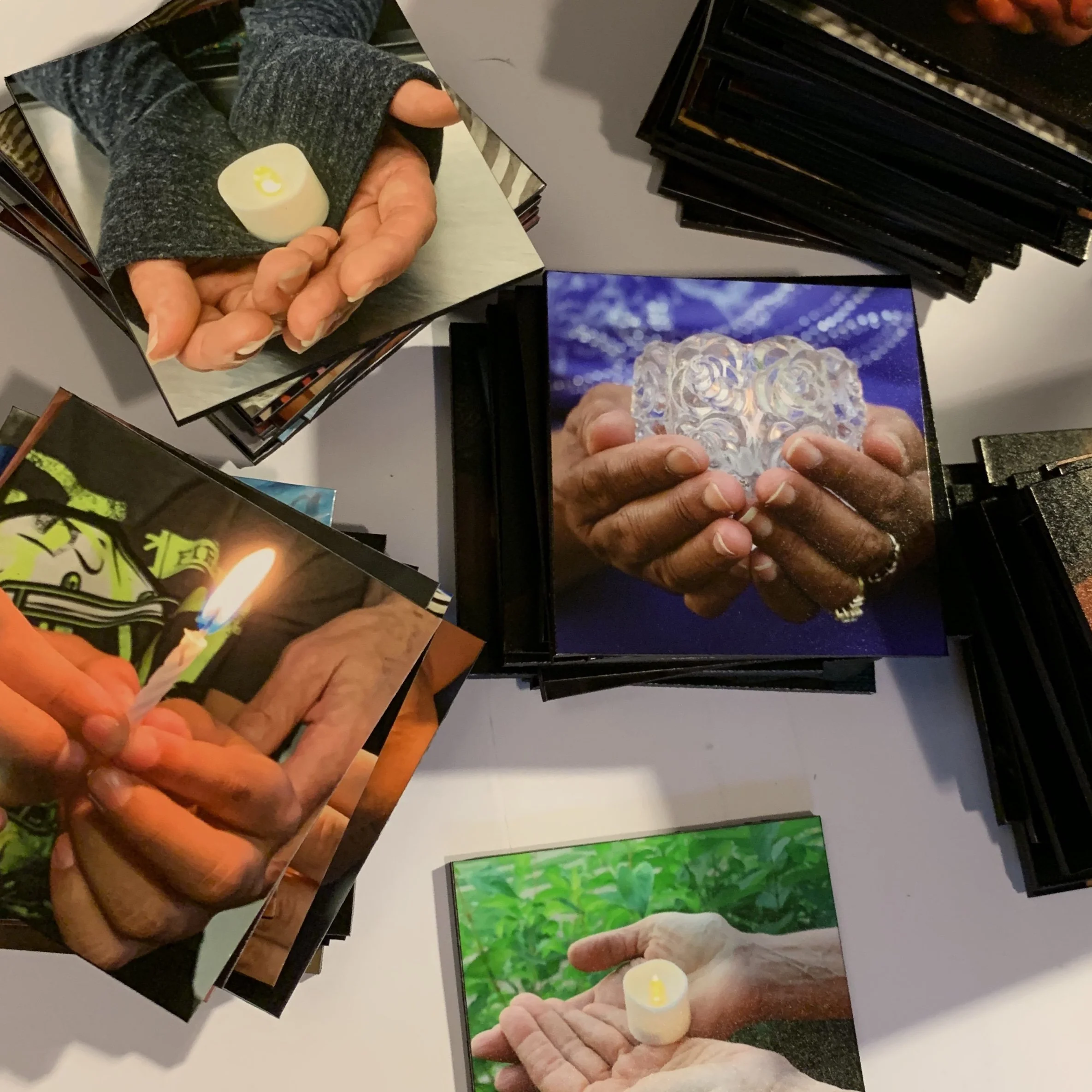 Stacks of the beautiful photo tiles of each individual candle.