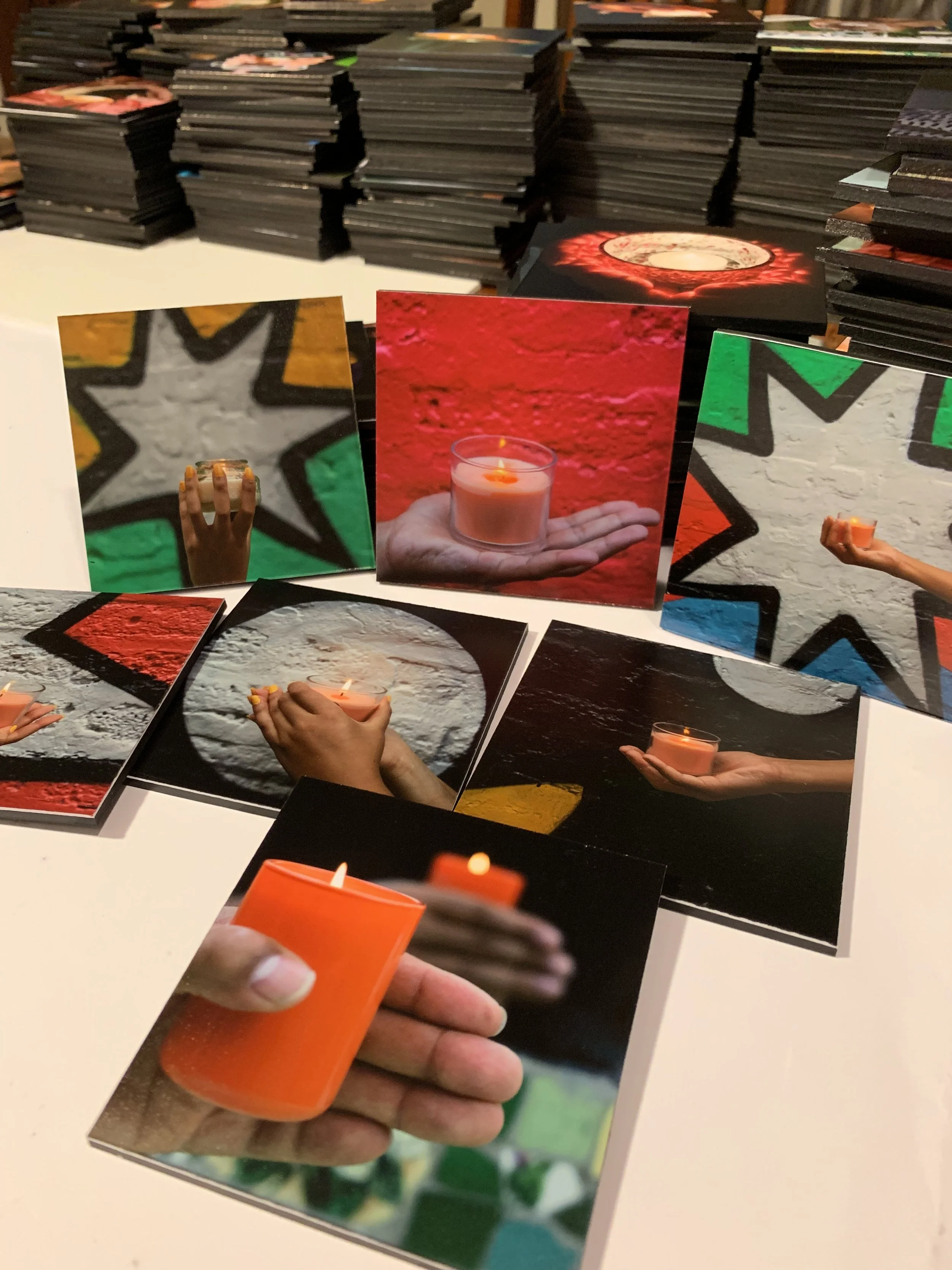 Stacks of the beautiful photo tiles of each individual candle.
