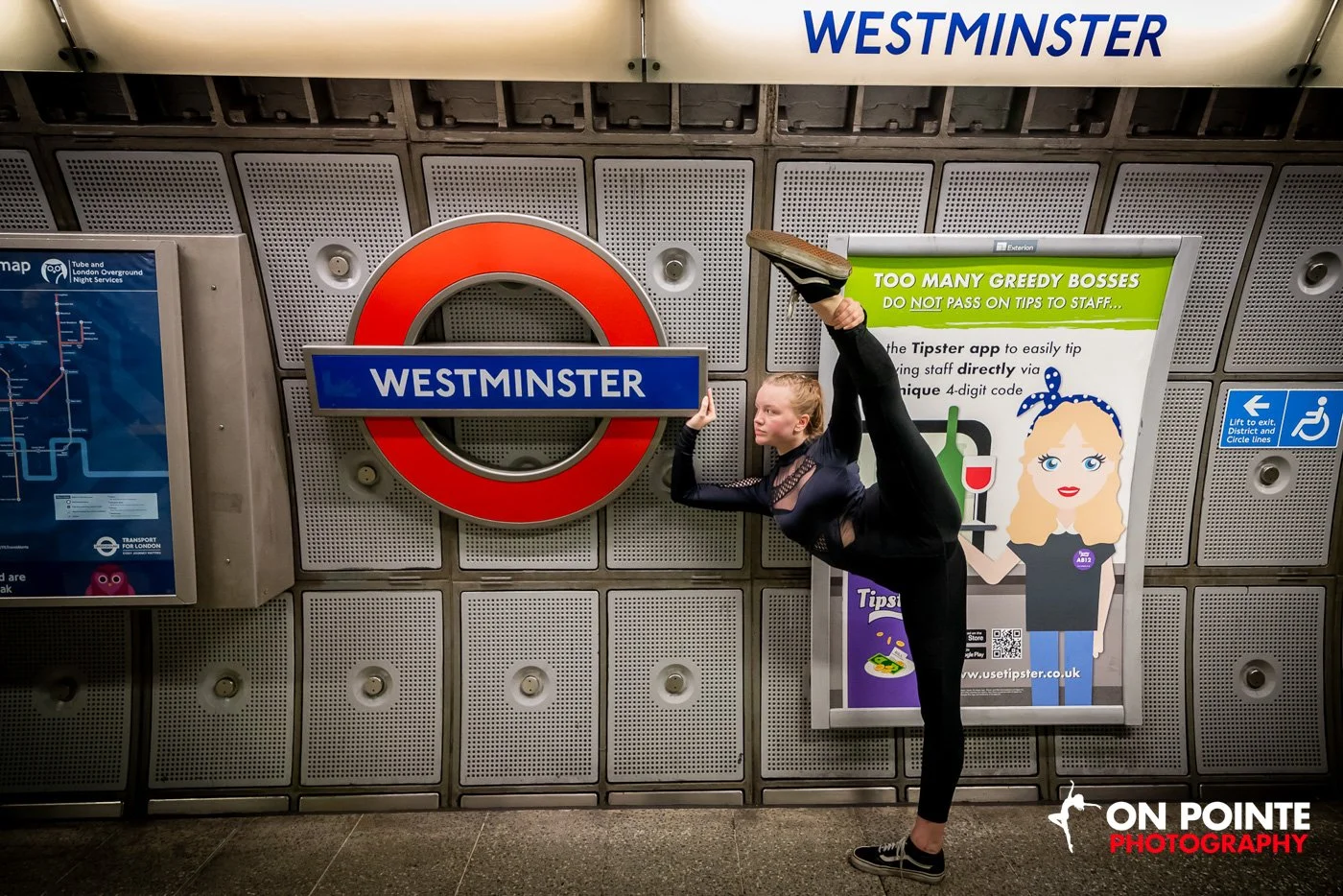 Dancer performing a split at Westminster Underground Station.