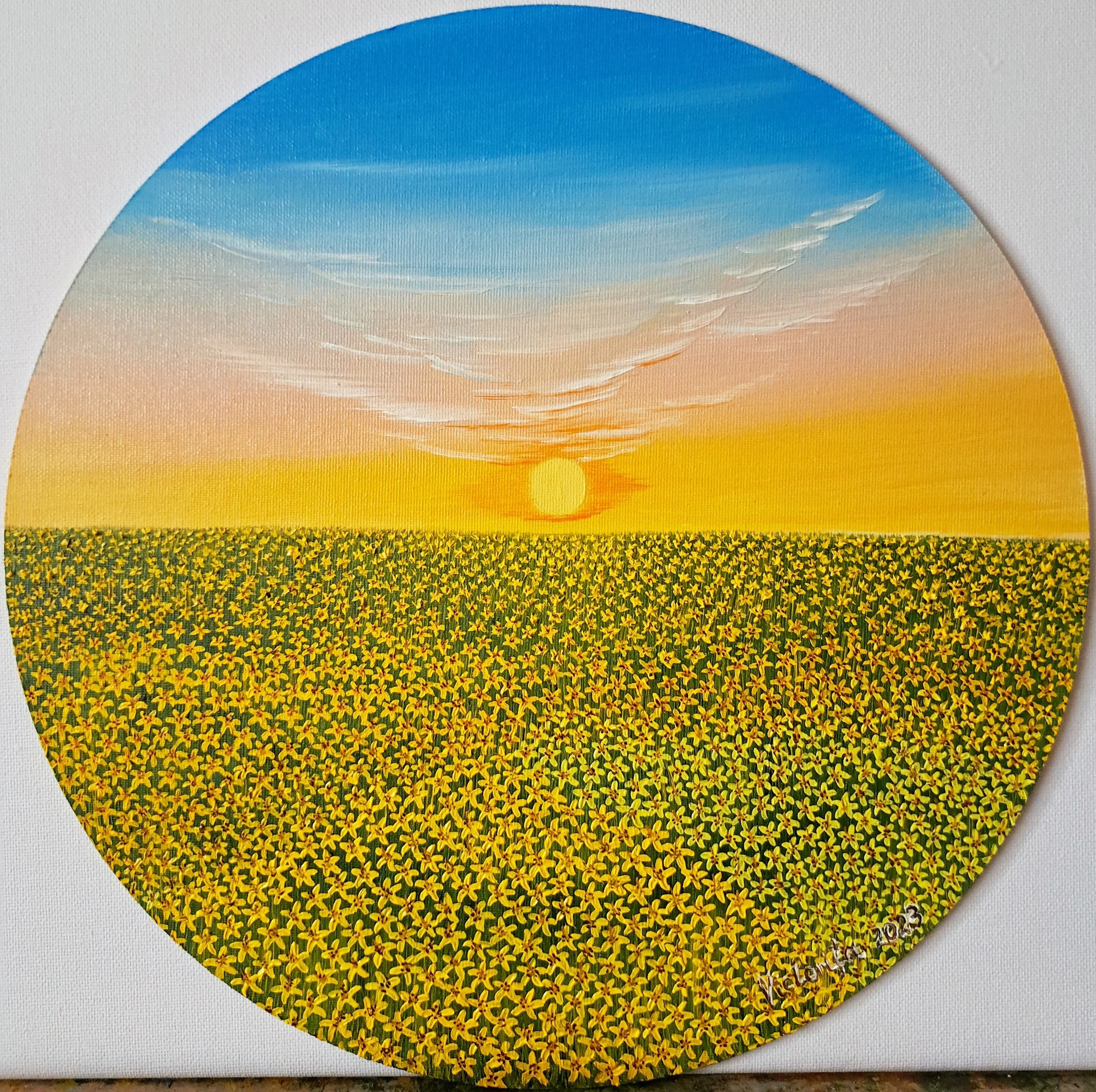 A circular artwork with a landscape scene featuring a blue sky with light clouds, a yellow-orange sun setting, and a field of yellow flowers at the bottom.