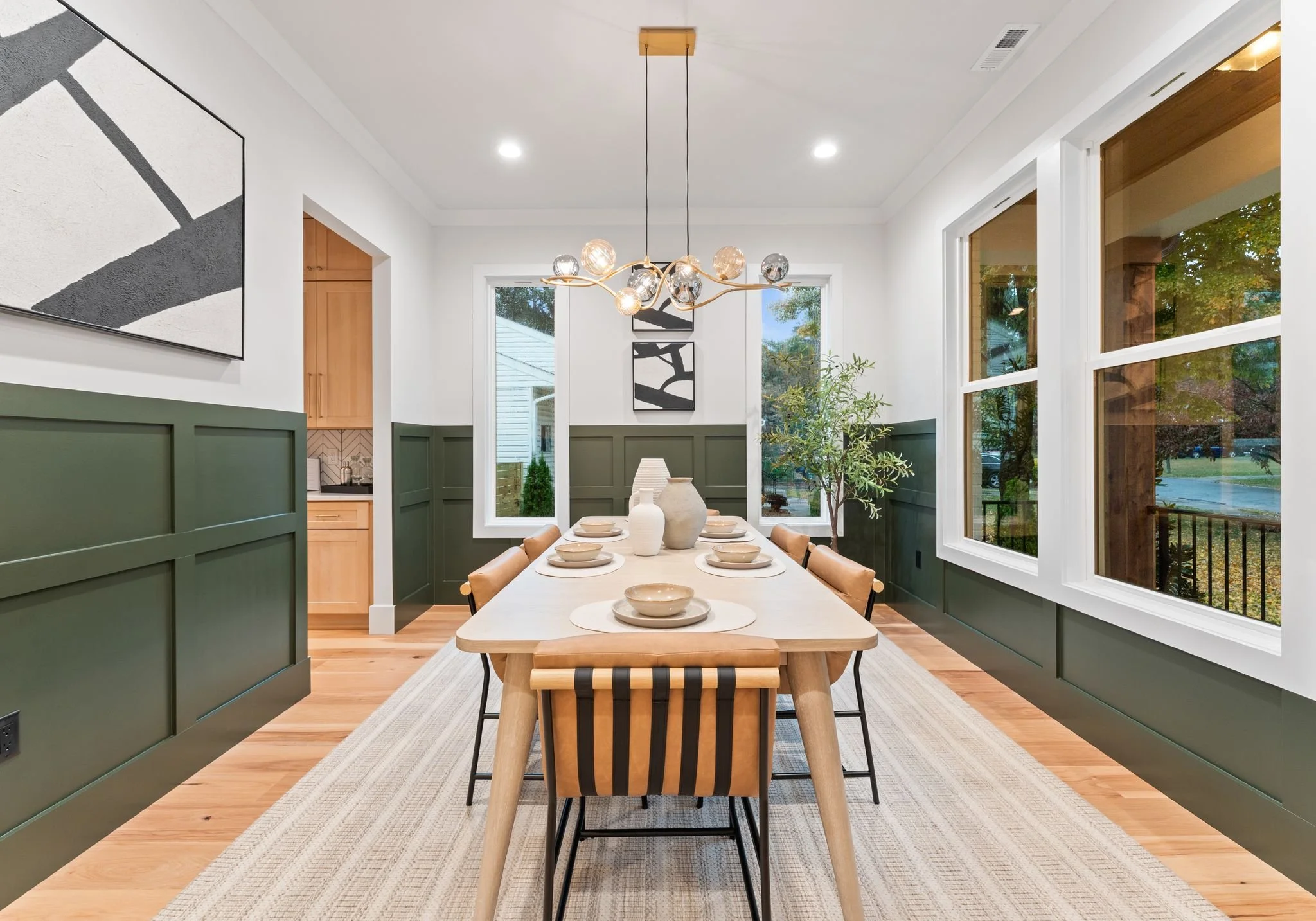 Green, white, black and light wood dining room