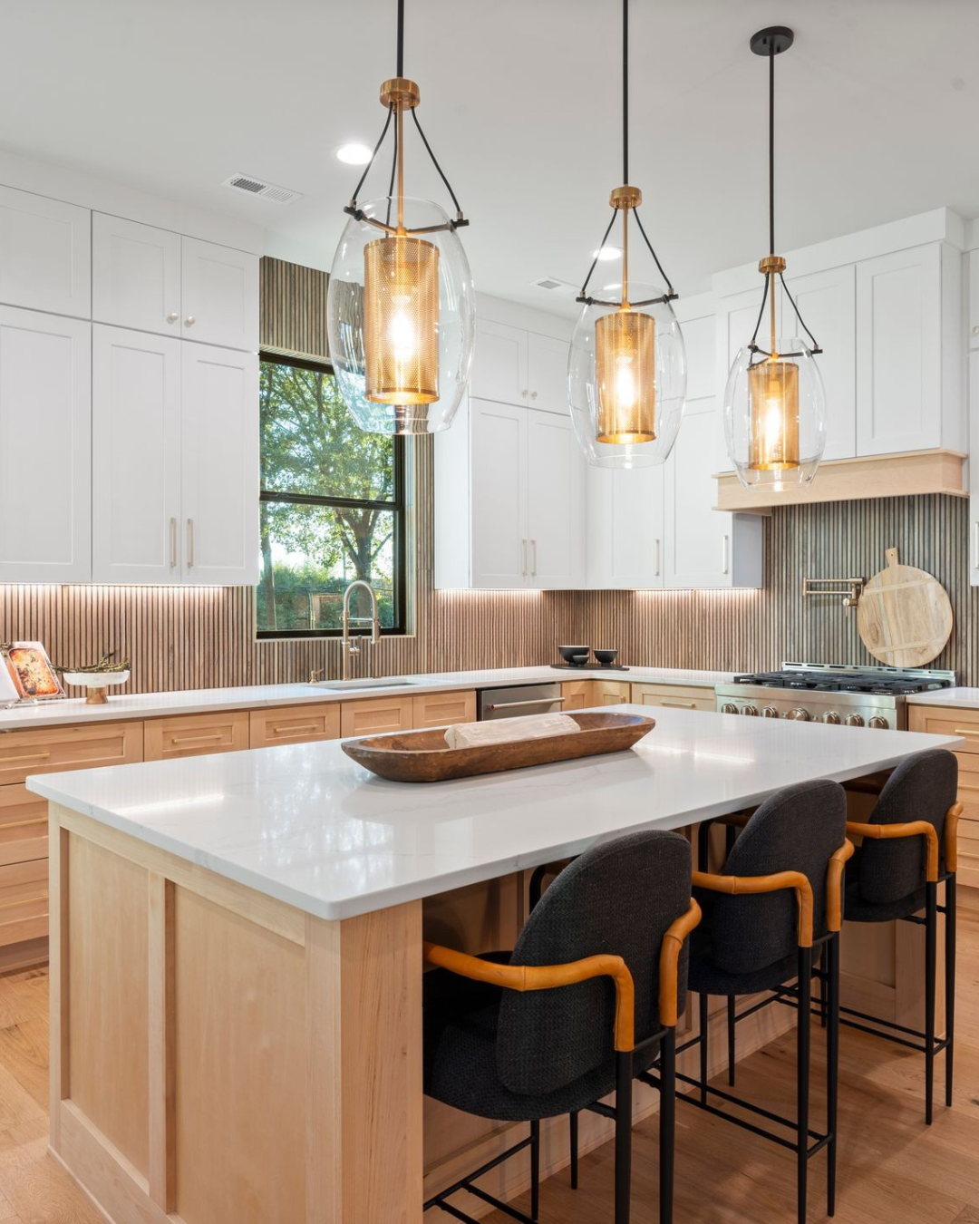 Kitchen with island and modern backsplash