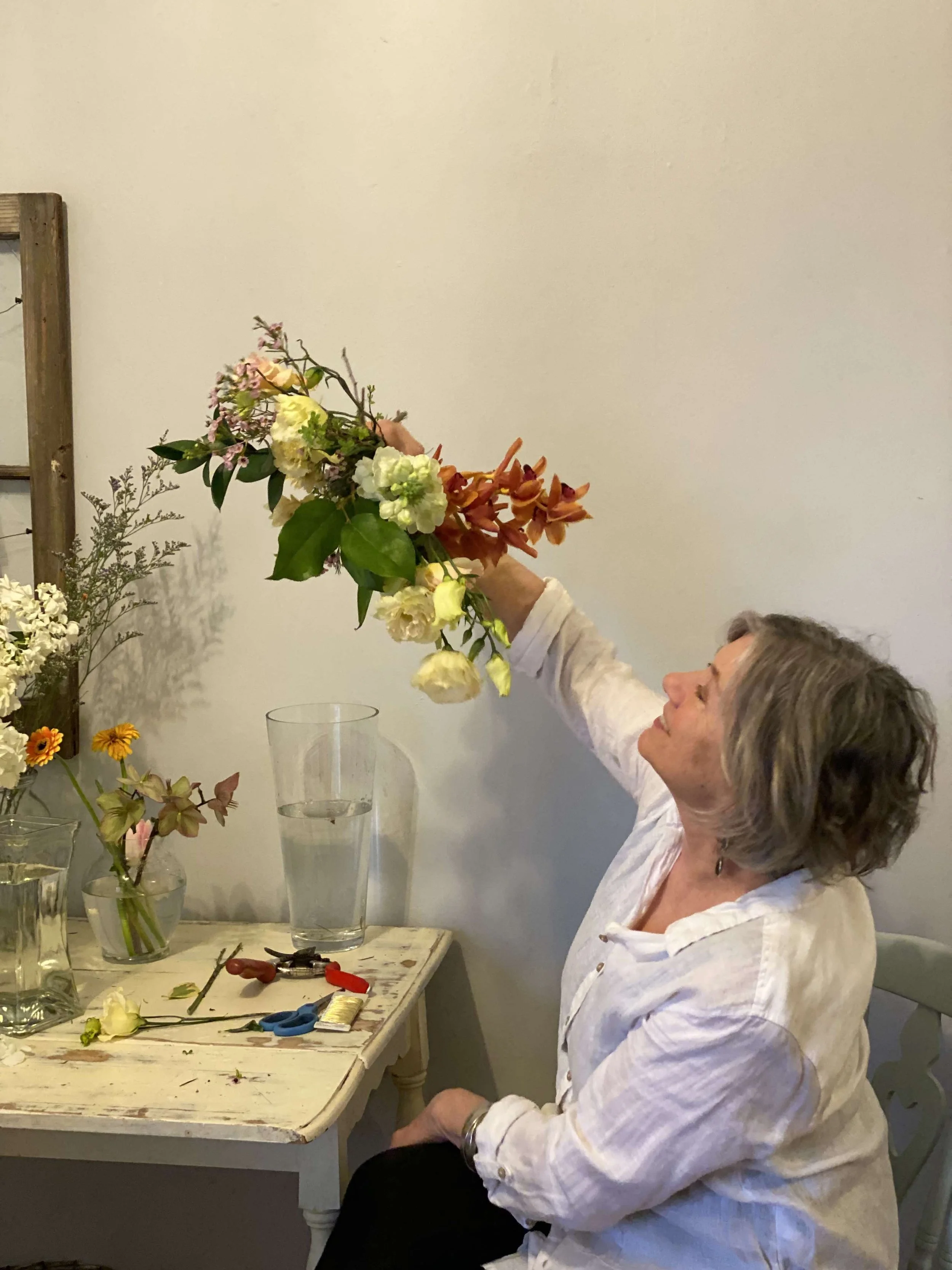 Anne looking up at flowers