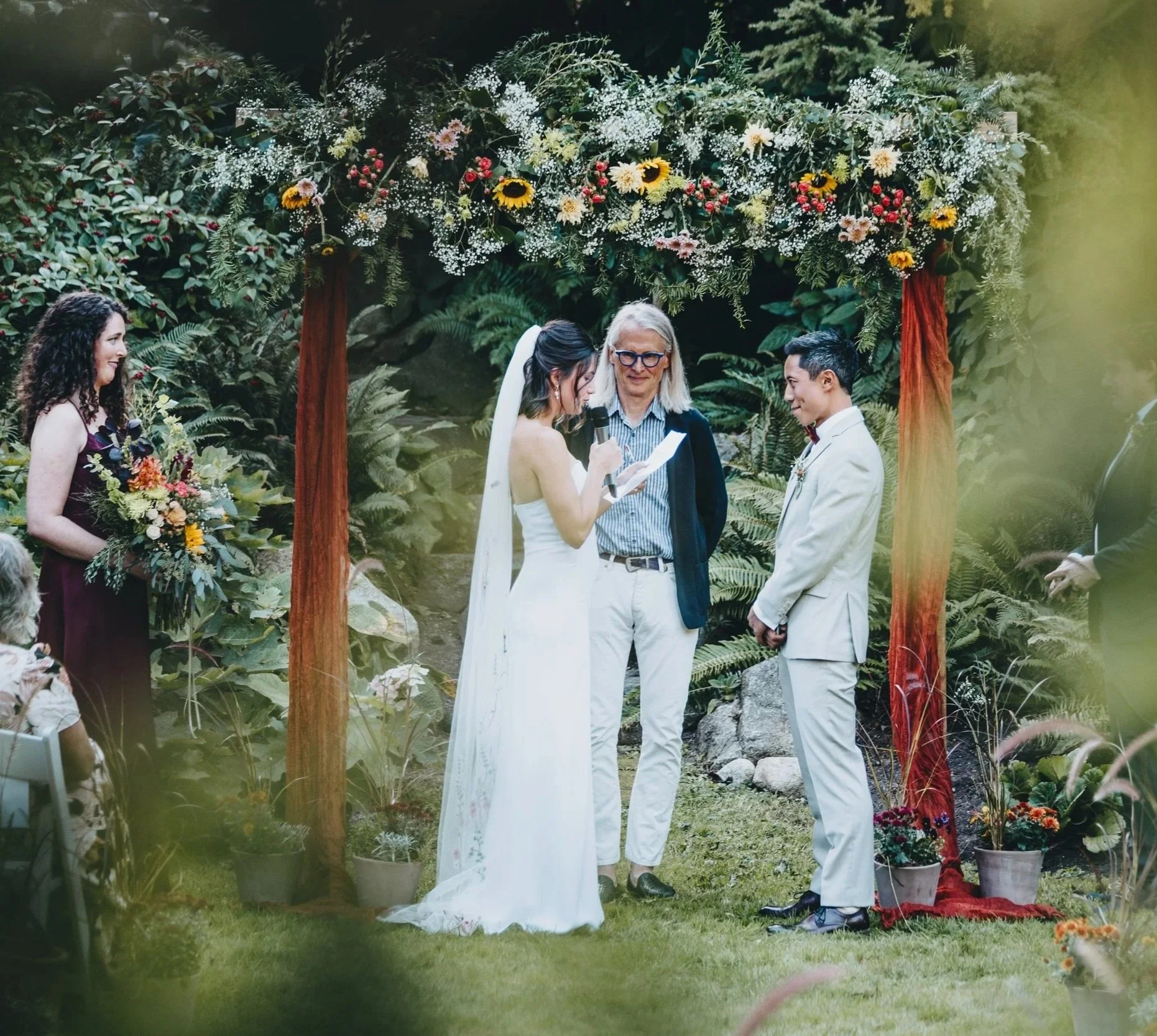 Bride groom floral arch marriage commissioner