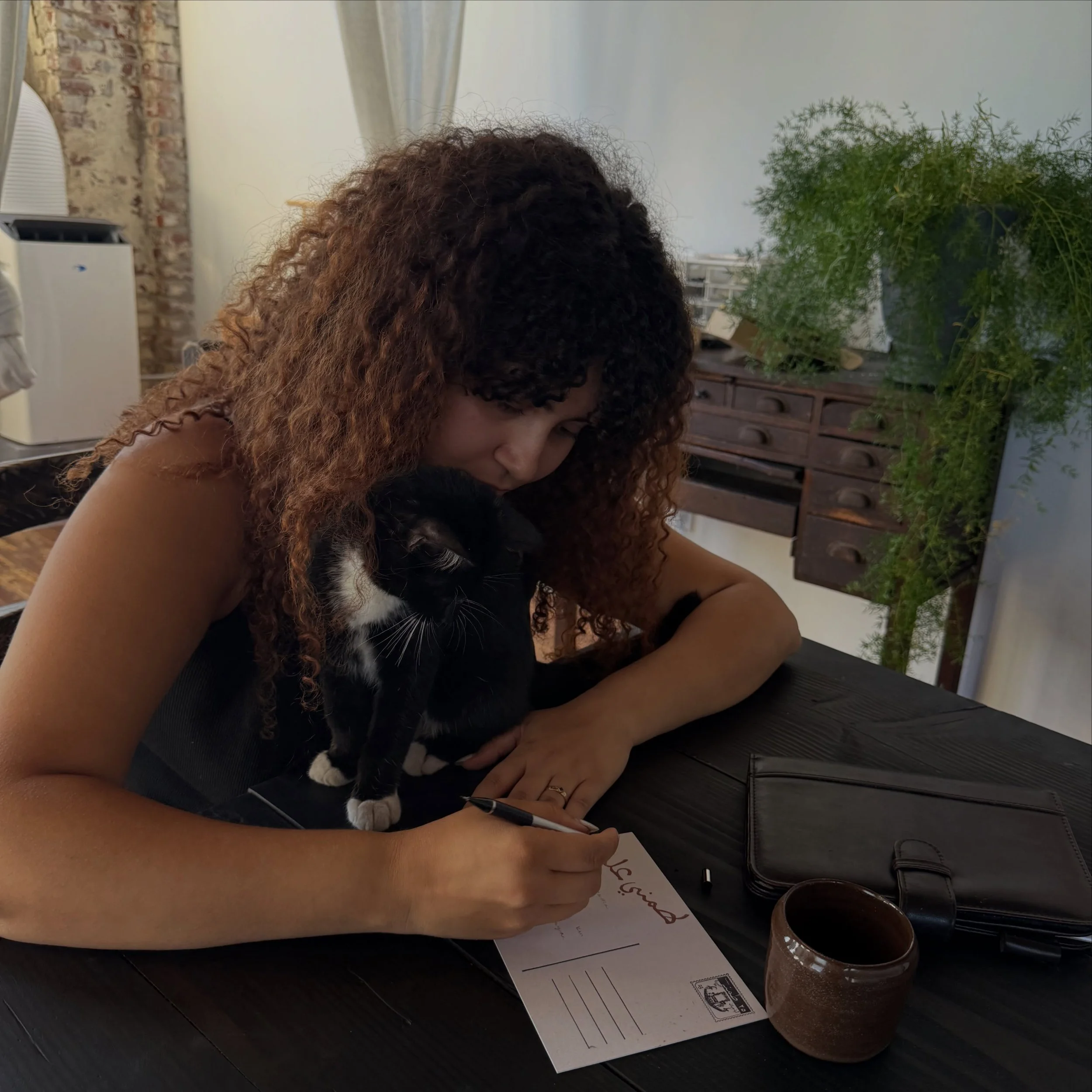 mariam &amp; sultan writing tammini alek letters at @beit_wisal