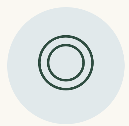 A stylized icon of three concentric circles, with the innermost circle being the smallest and all having a dark outline, on a light blue circular background.