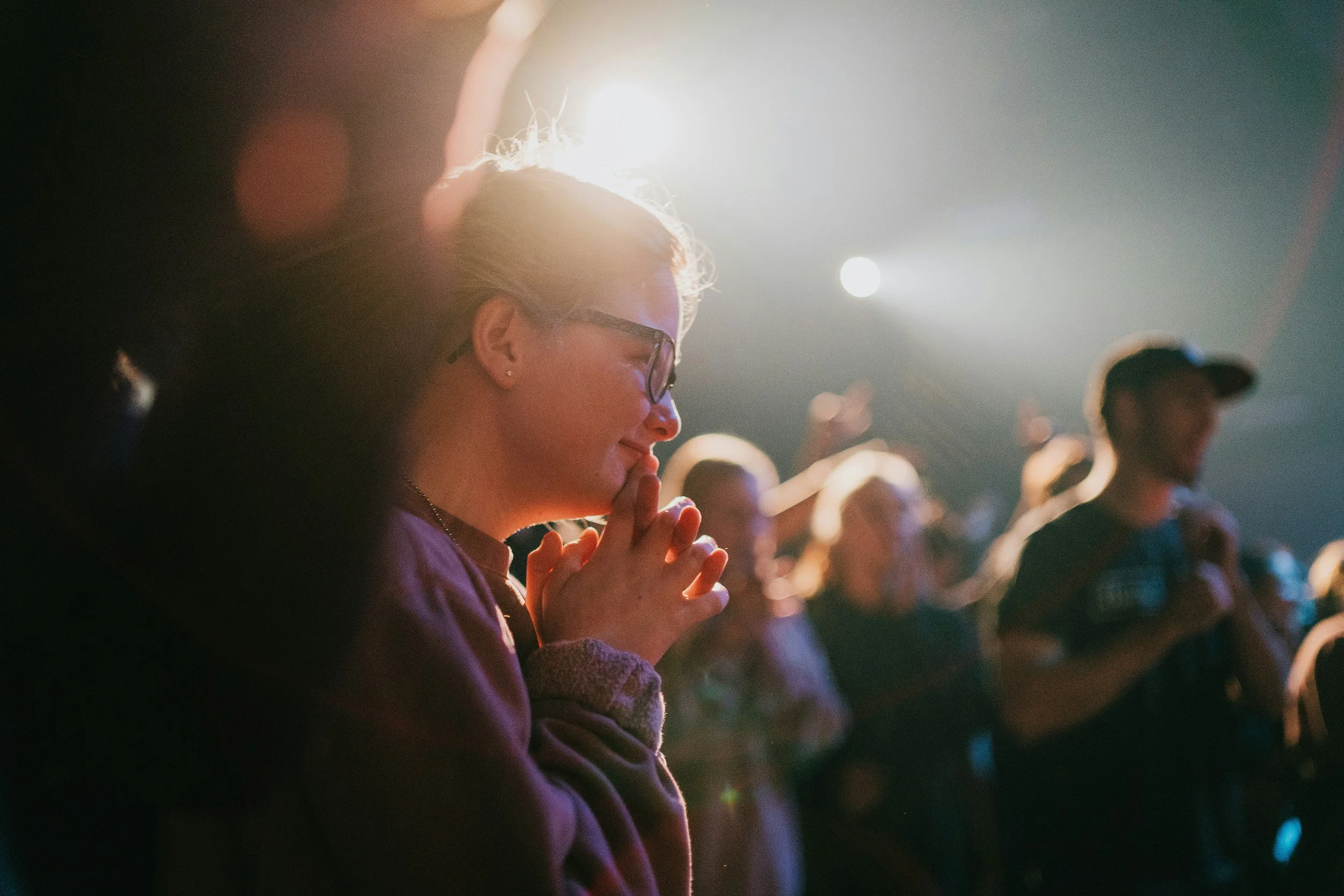 A person in a crowd with a look of joy