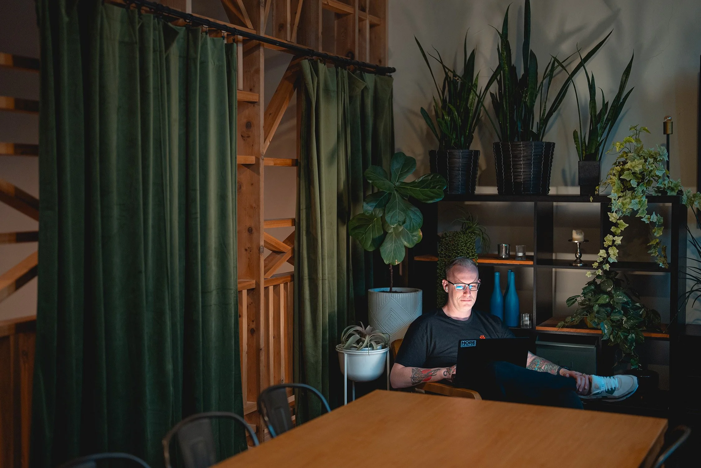 Chris working with his laptop in an office